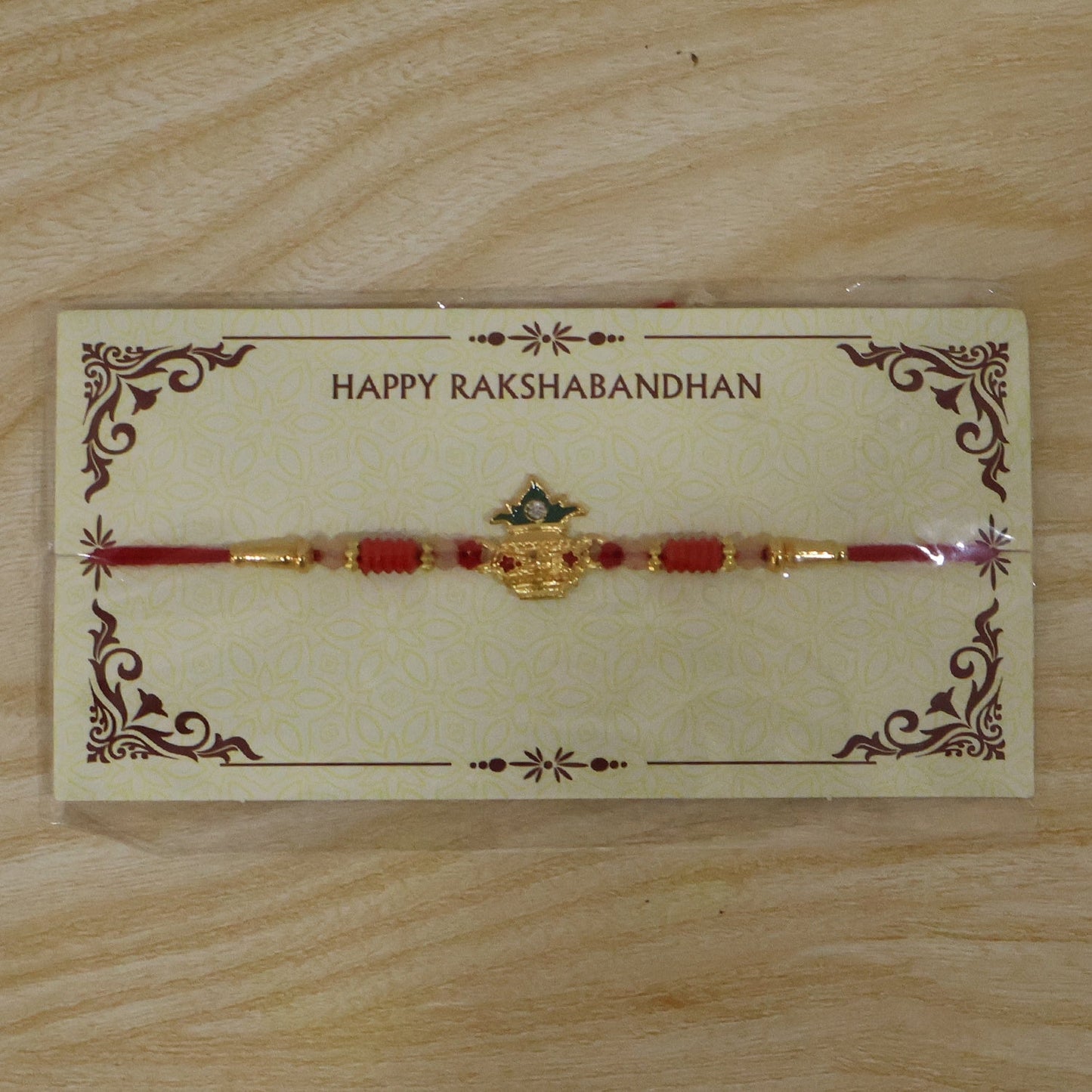 Sacred Kalash Rakhi showcasing thread and beads