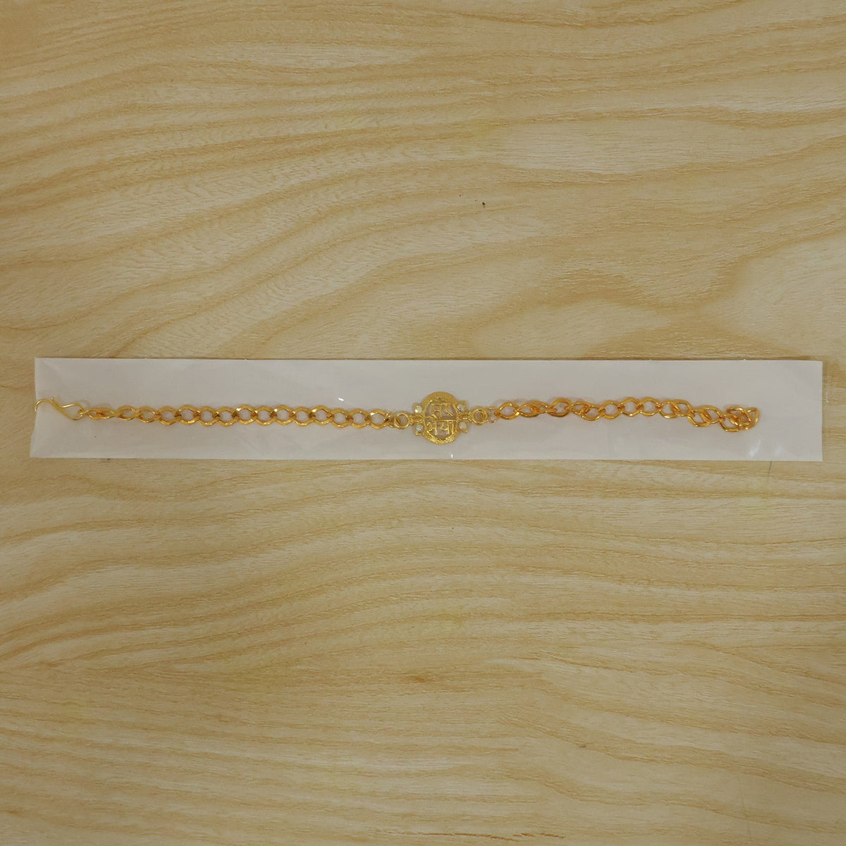 Sparkling stone details on the Mere Bhaiya gold-plated bracelet rakhi.