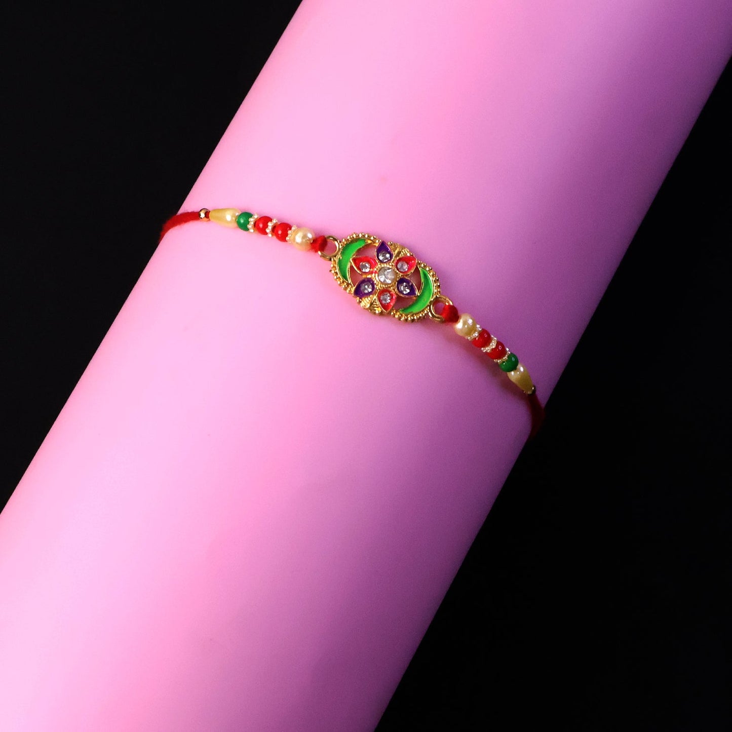 Festive Rakhi for brother featuring colorful stones and beads