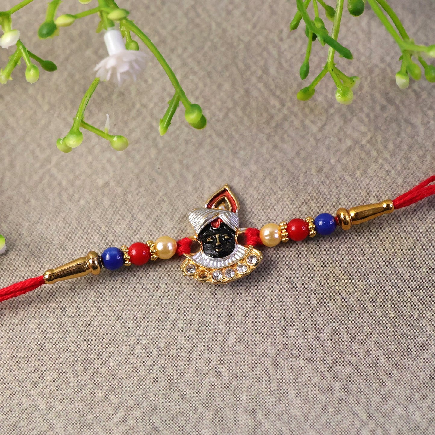 Colorful Krishna Rakhi with intricate detailing