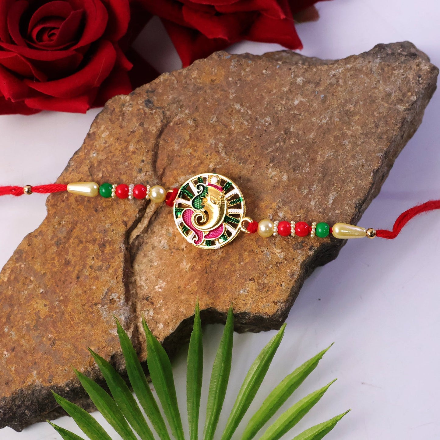 Ganesha Rakhi tied on wrist, festive styling