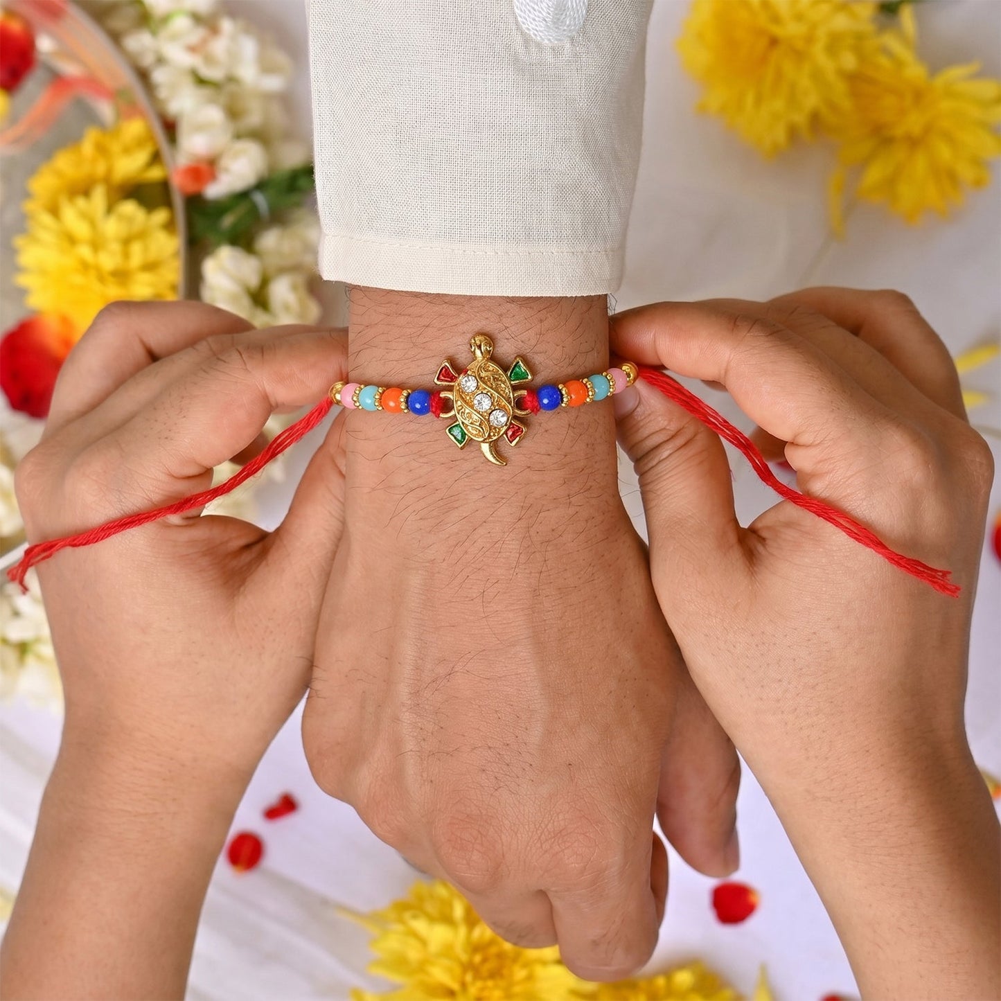 Colorful beaded thread display of turtle Rakhi for Rakshabandhan