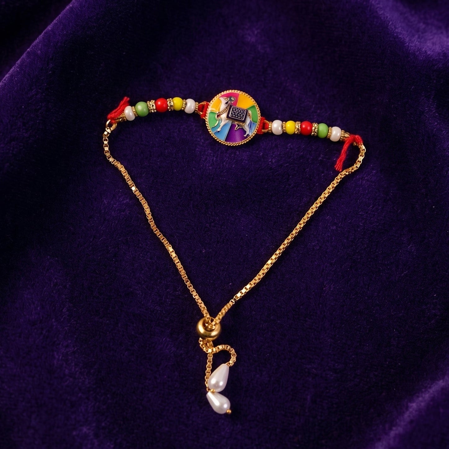 Side view of traditional cow motif Rakhi with beads