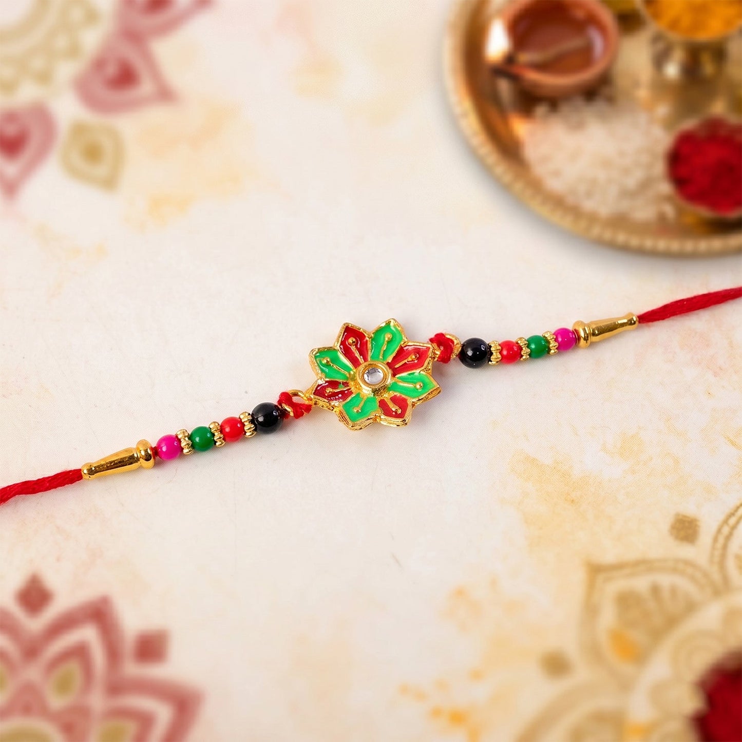 Traditional floral Rakhi tied on wrist