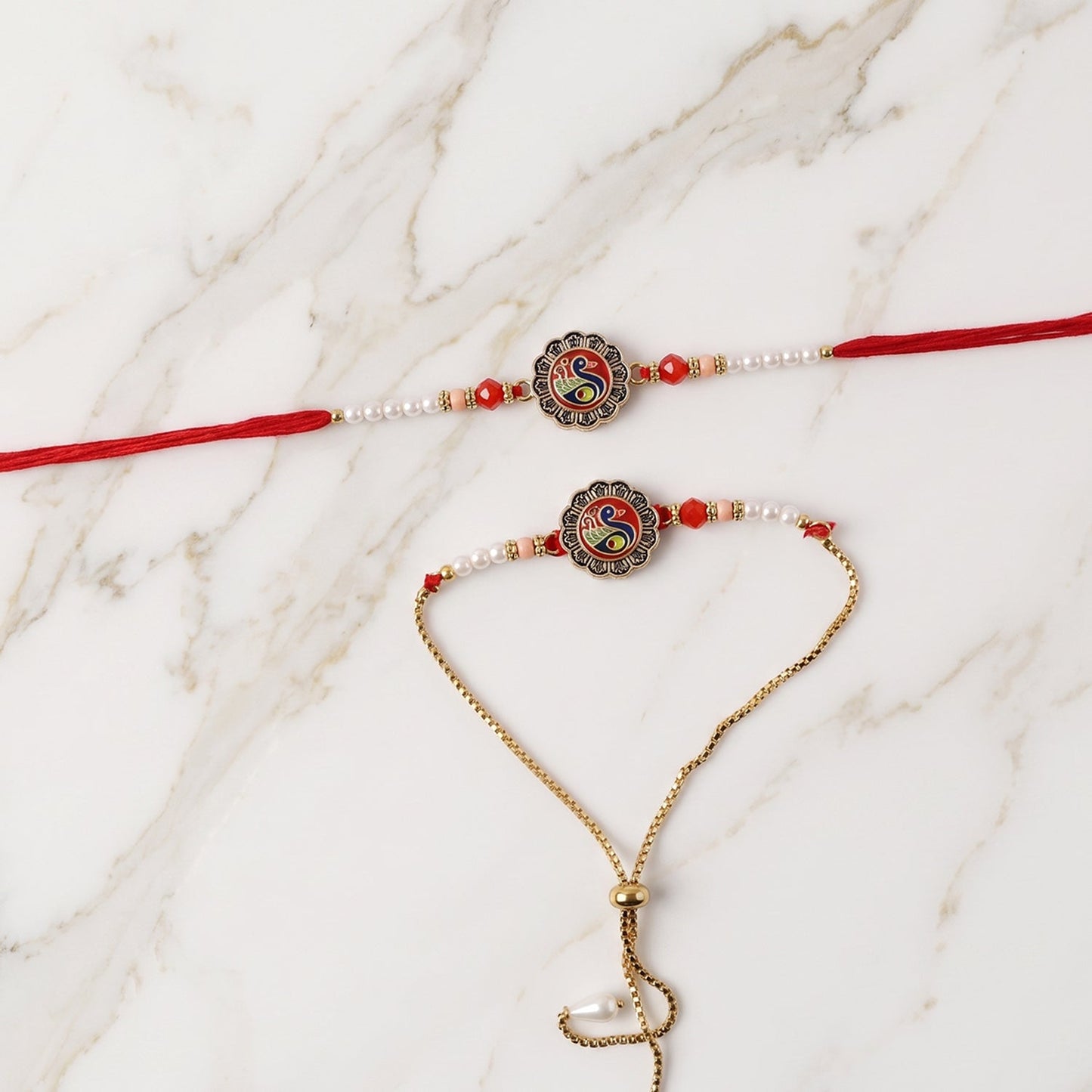 Designer Peacock Rakhi close-up featuring intricate peacock pattern and pearl accents