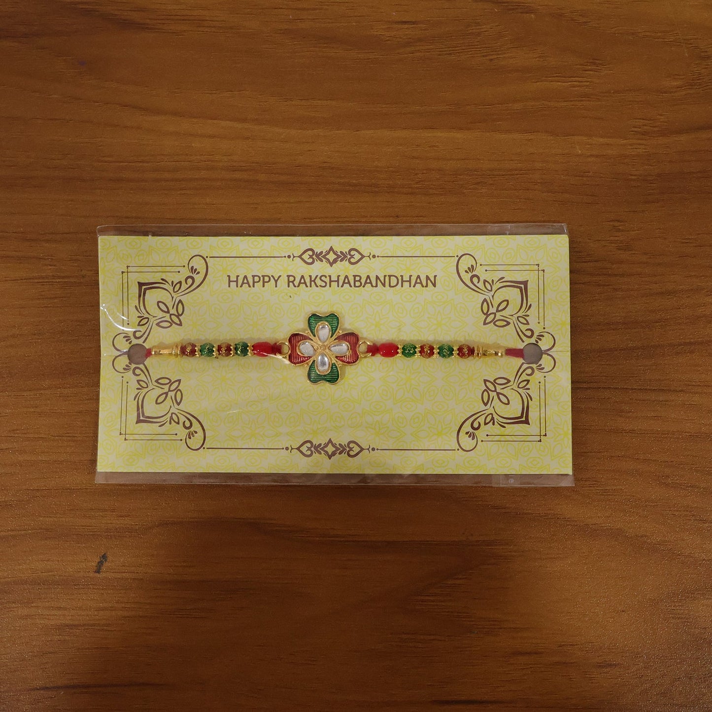 Rakshabandhan floral stone designer rakhi on festive background