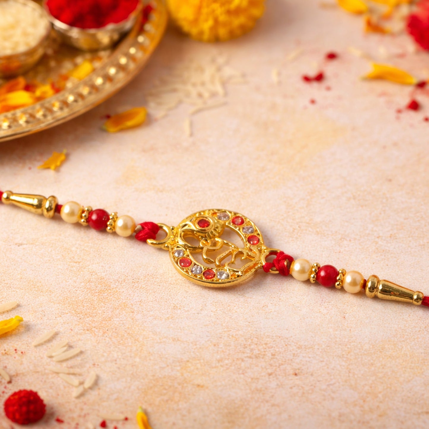 Close-up of Radhe name Rakhi showing stones and beads