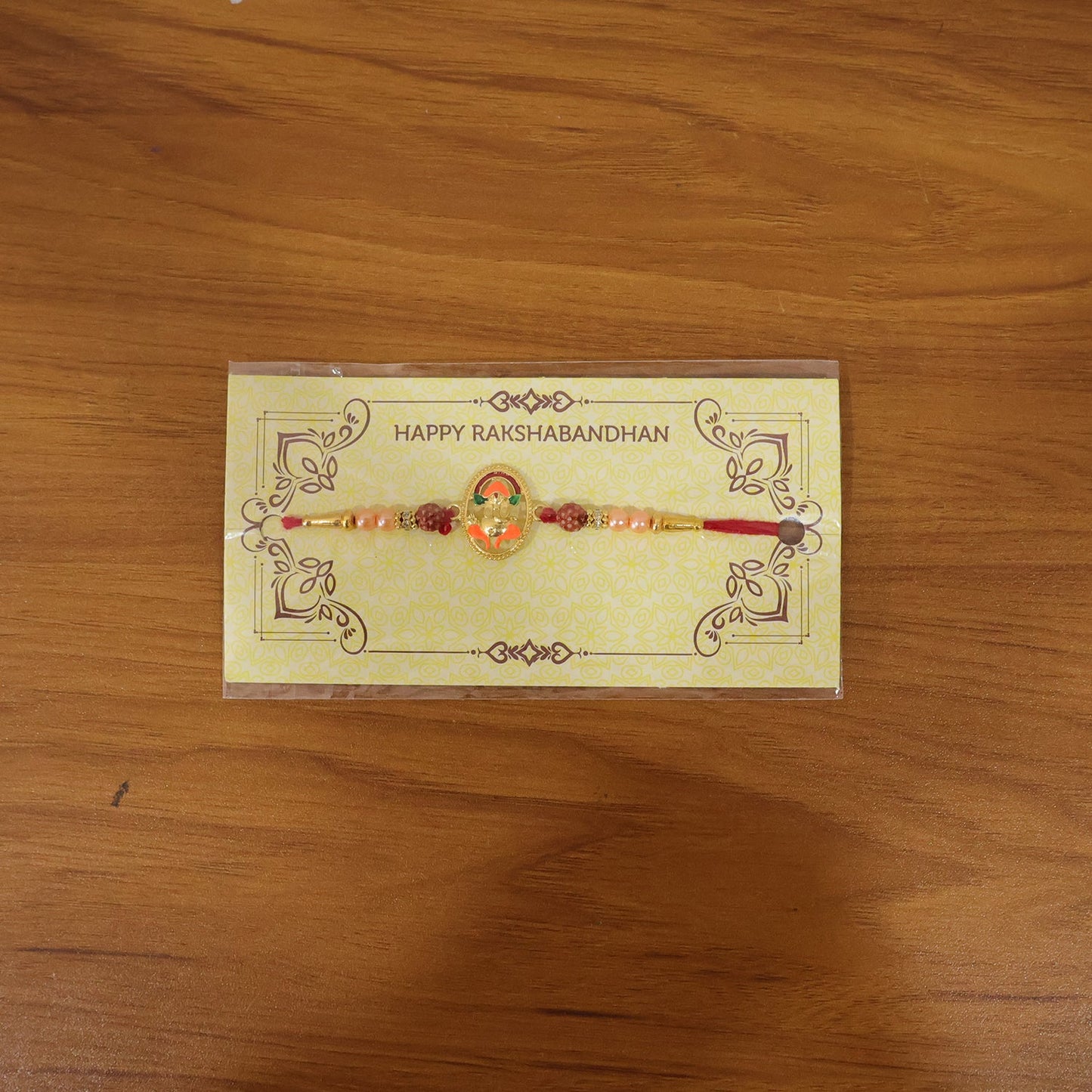 Live image of Ganesha design rakhi on hand