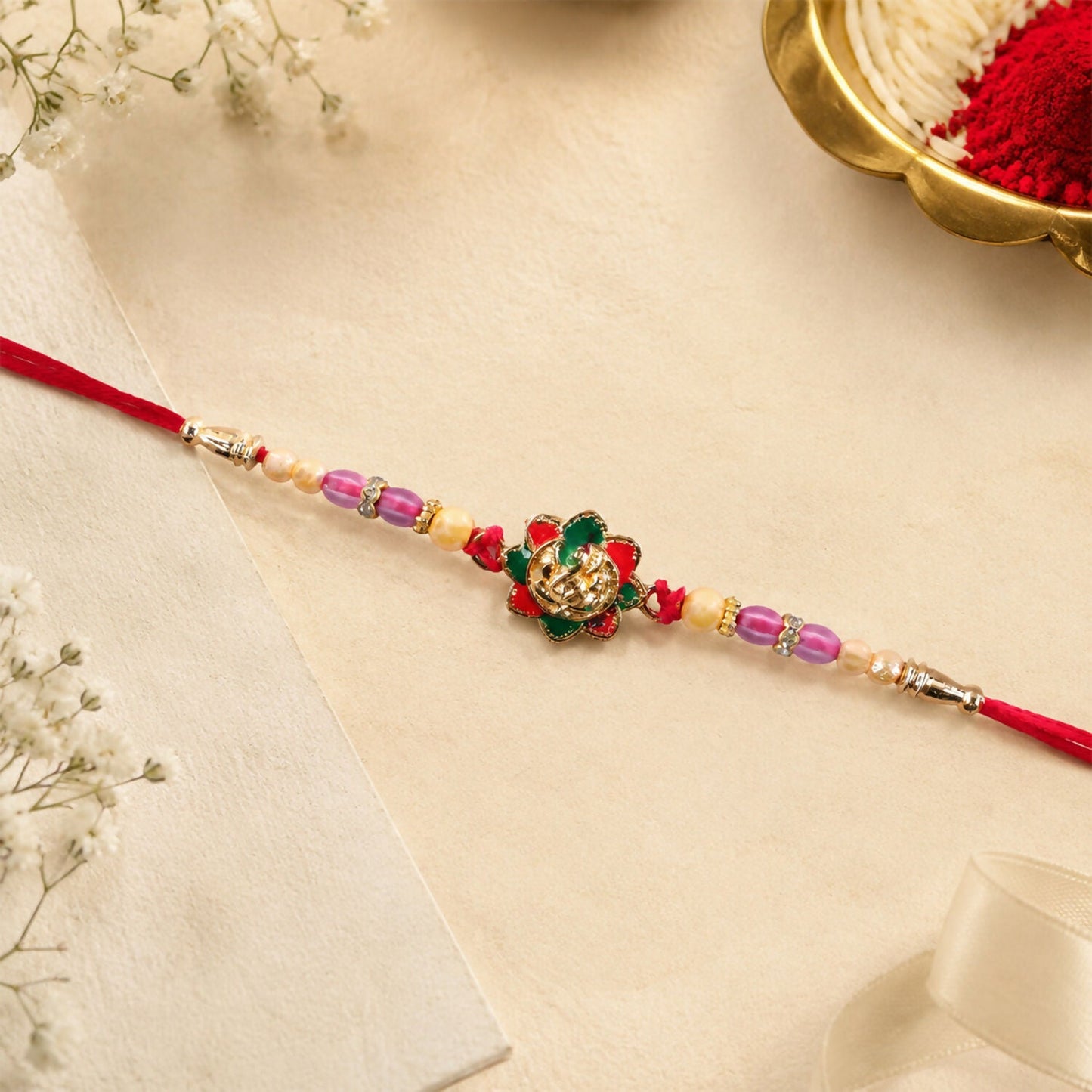 Traditional floral beads Ganesha Rakhi for Raksha Bandhan