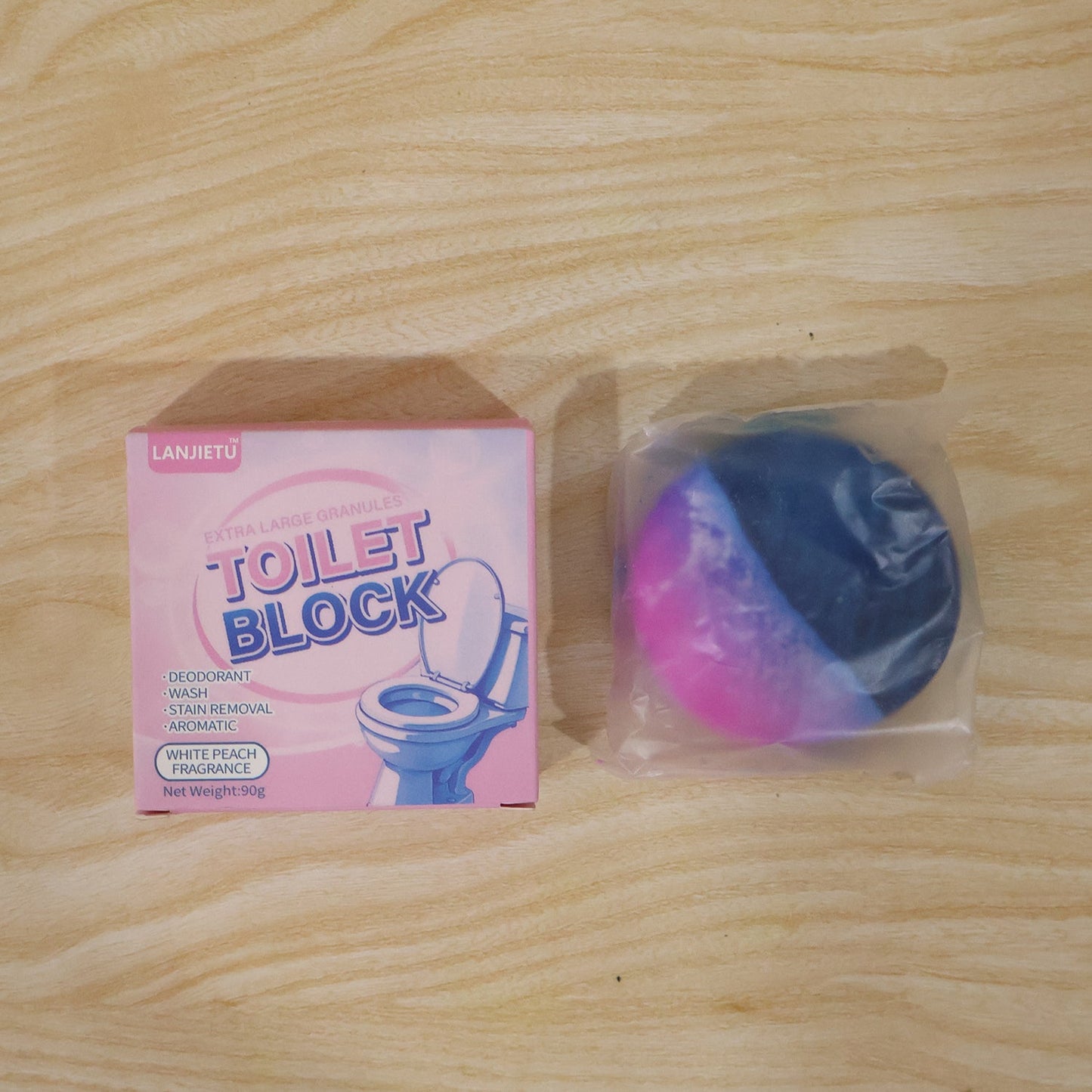 Blue flush toilet cleaner block with white peach scent