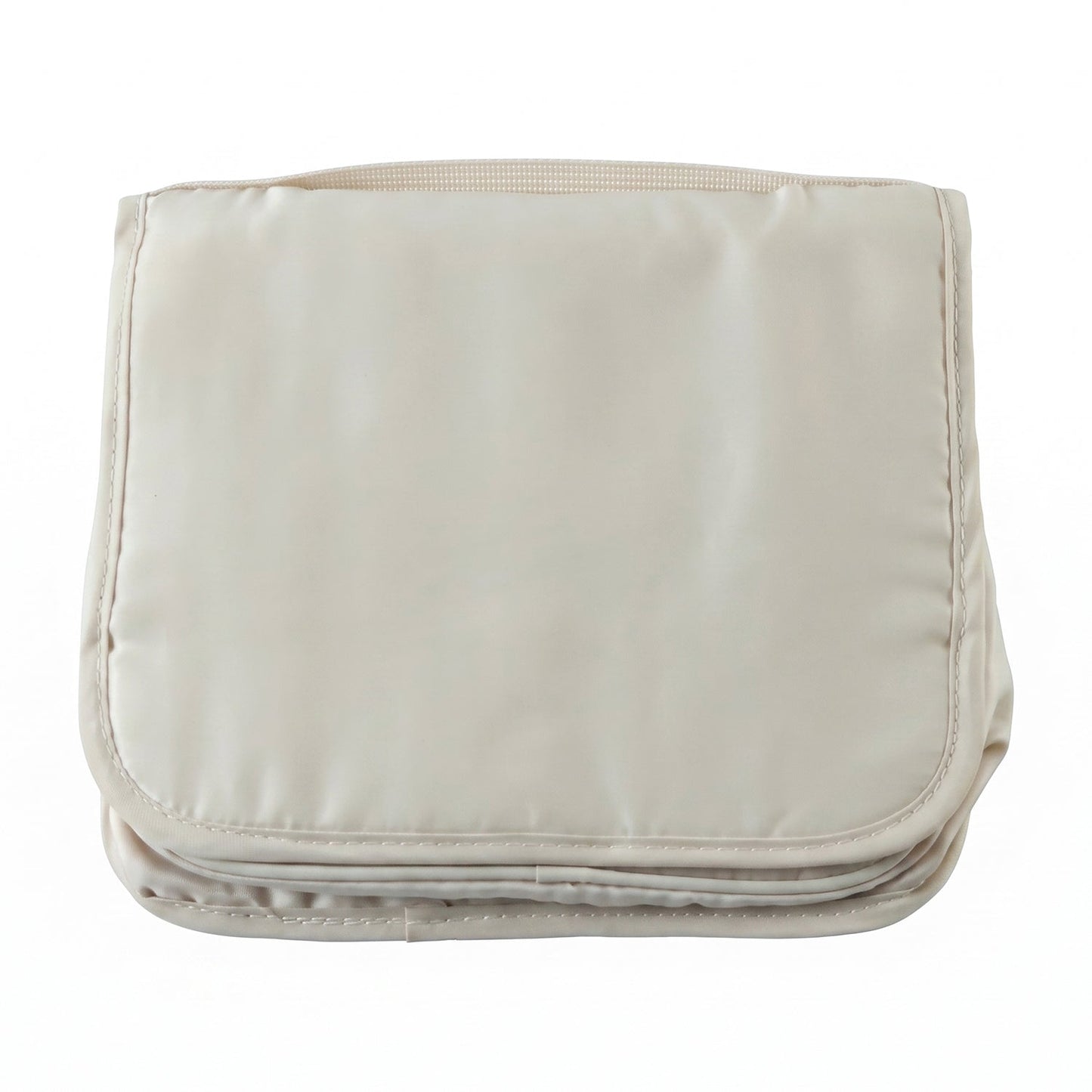 A neatly folded rectangular beige toiletry bag with a handle on a plain white background.