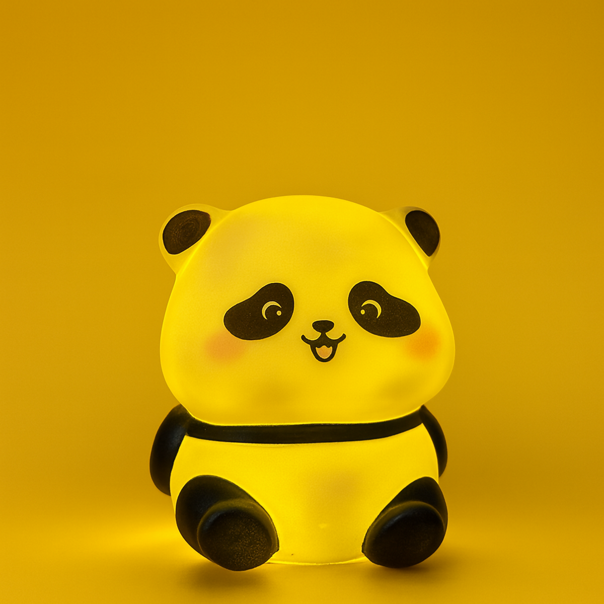 Close-up of panda-shaped LED night lamp showing warm glow
