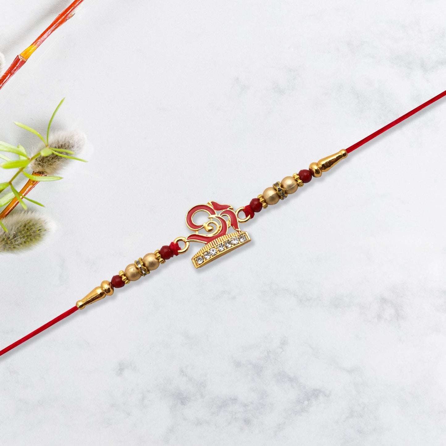 Intricate OM symbol detail on the Traditional Rakhi, showcasing fine artisan craftsmanship.