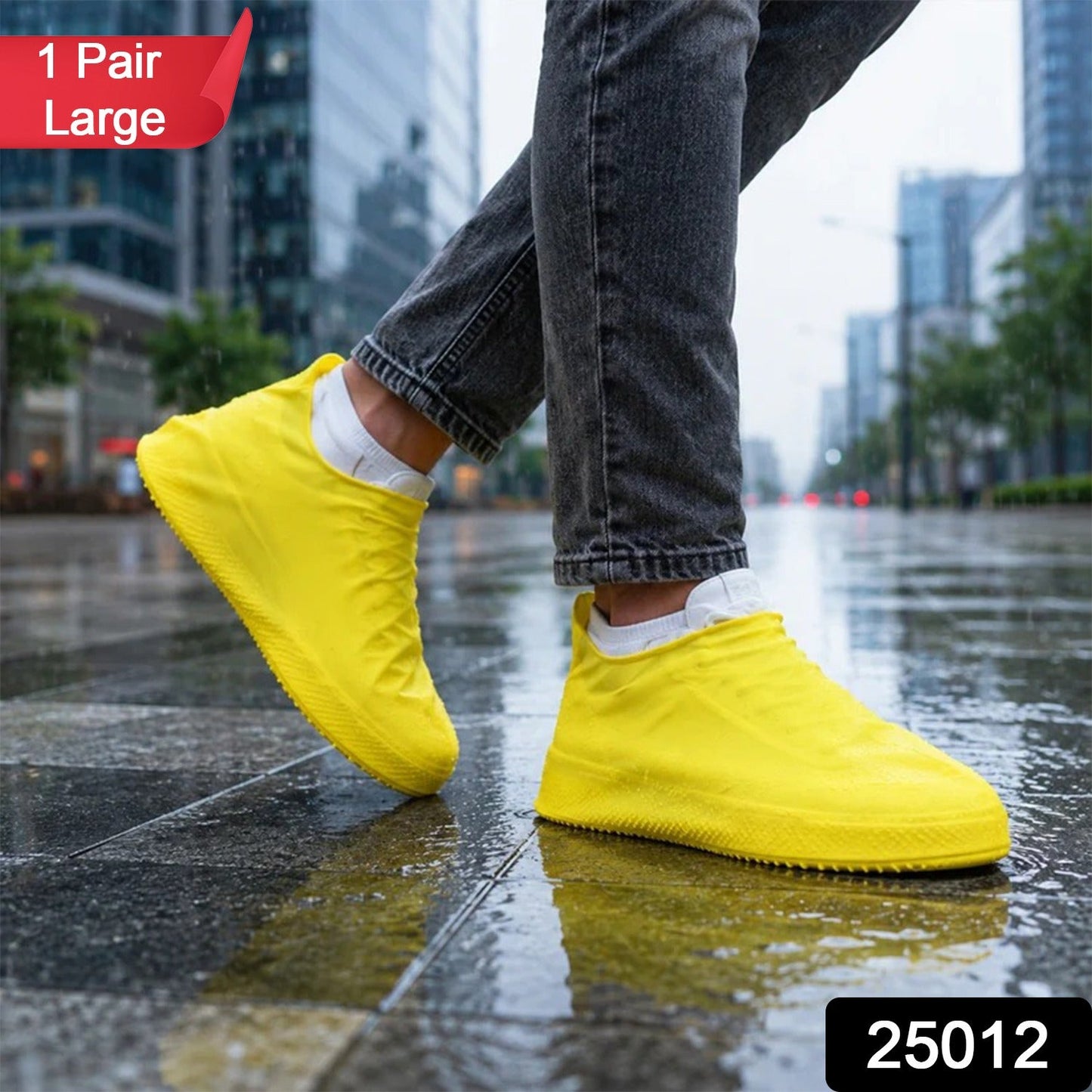 A person wearing gray jeans and white socks has bright yellow waterproof shoe covers over their shoes, standing on a wet