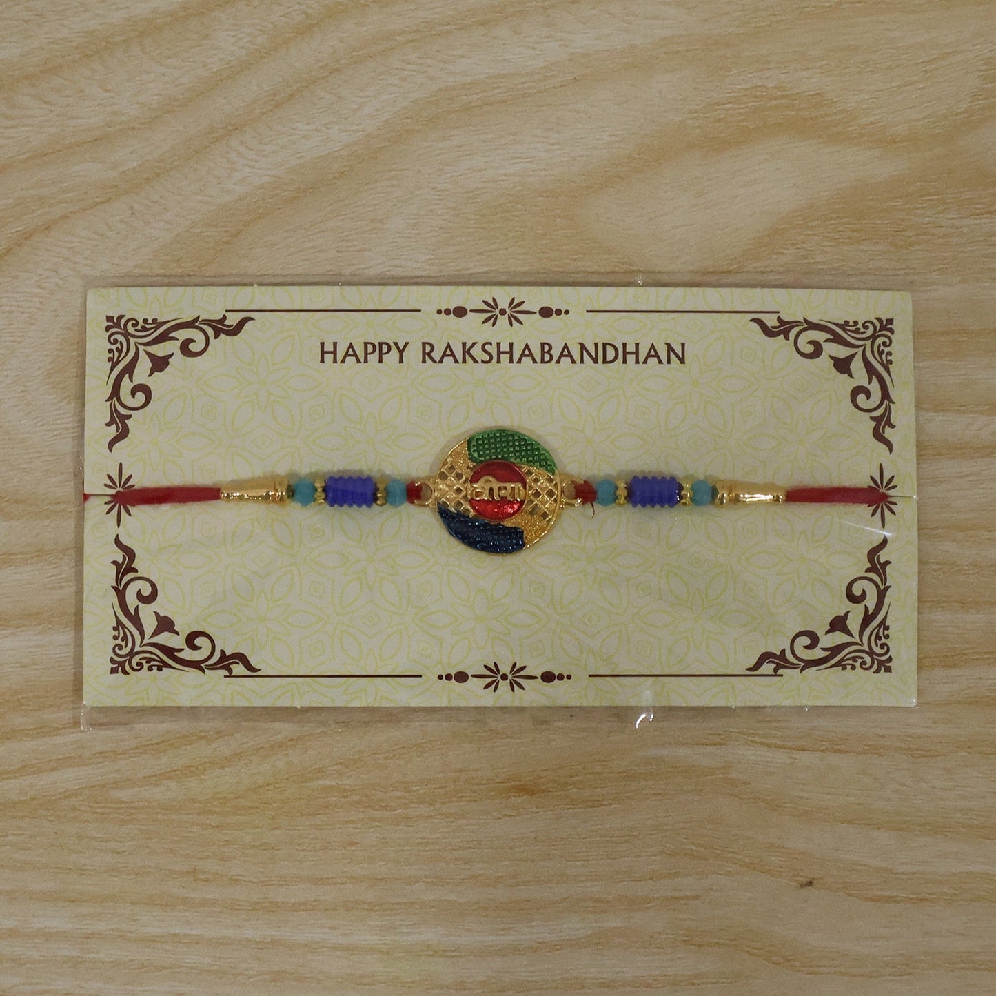 Rakhi displayed on white background