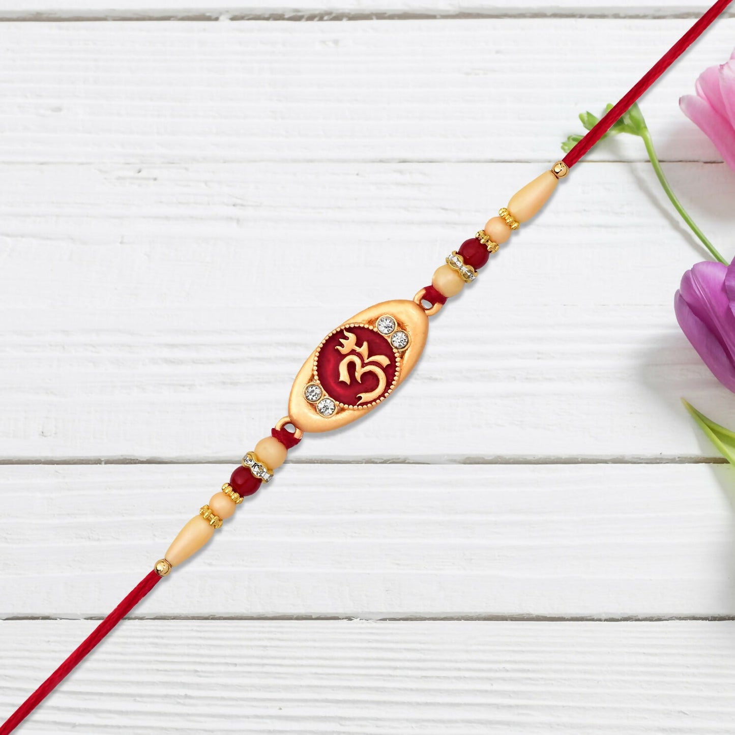 Detailed view of Om symbol on the sacred brother's Rakhi
