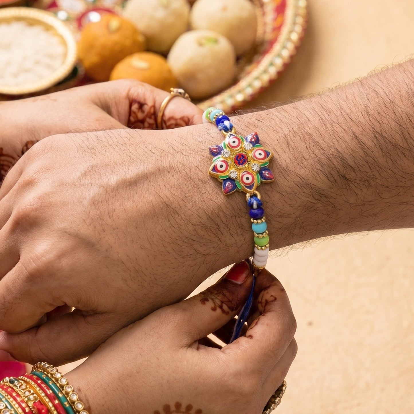 Close-up of stylish Evil Eye OM Star Rakhi centerpiece