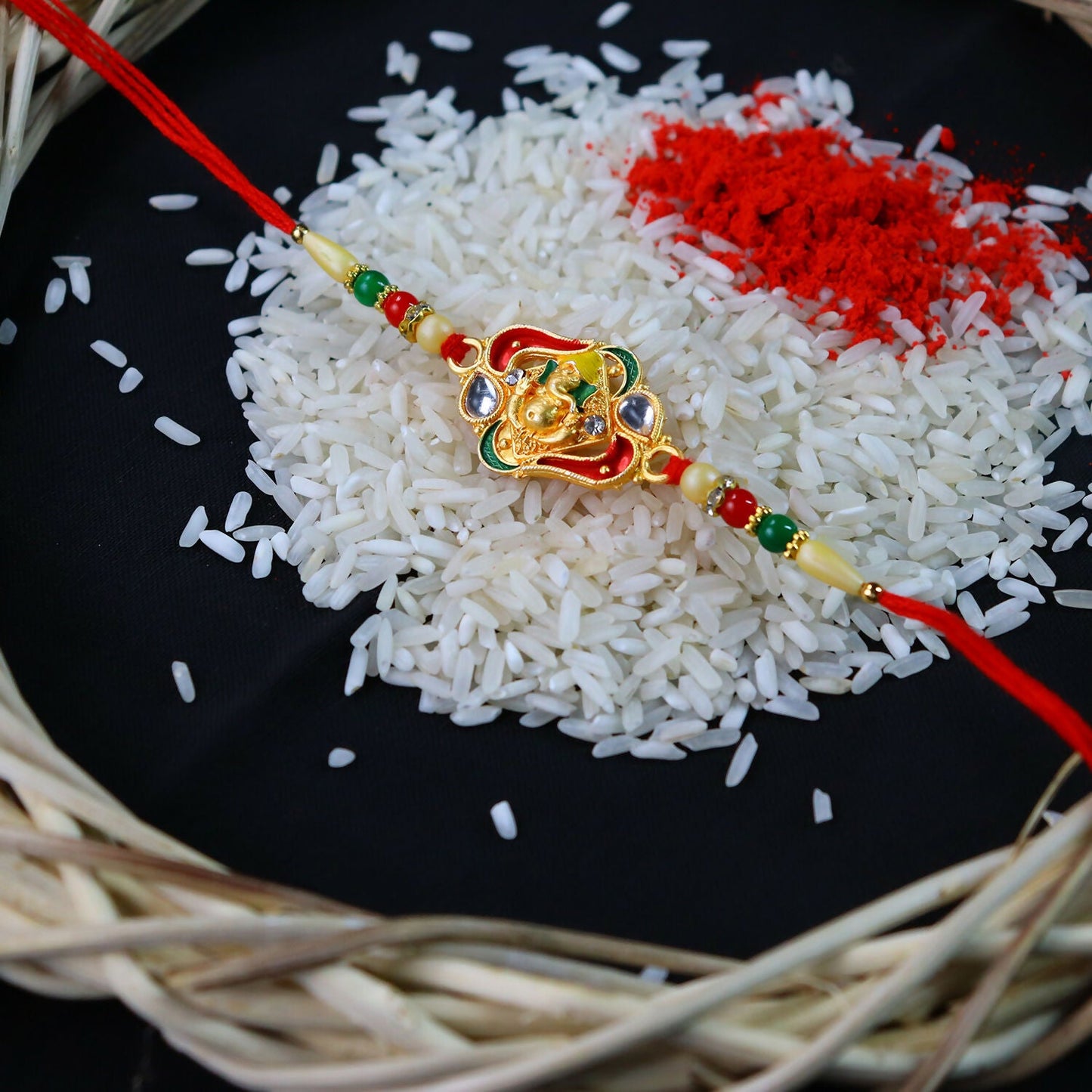 Close-up of Ganpati Bappa Ki Rakhi featuring traditional Ganpati design
