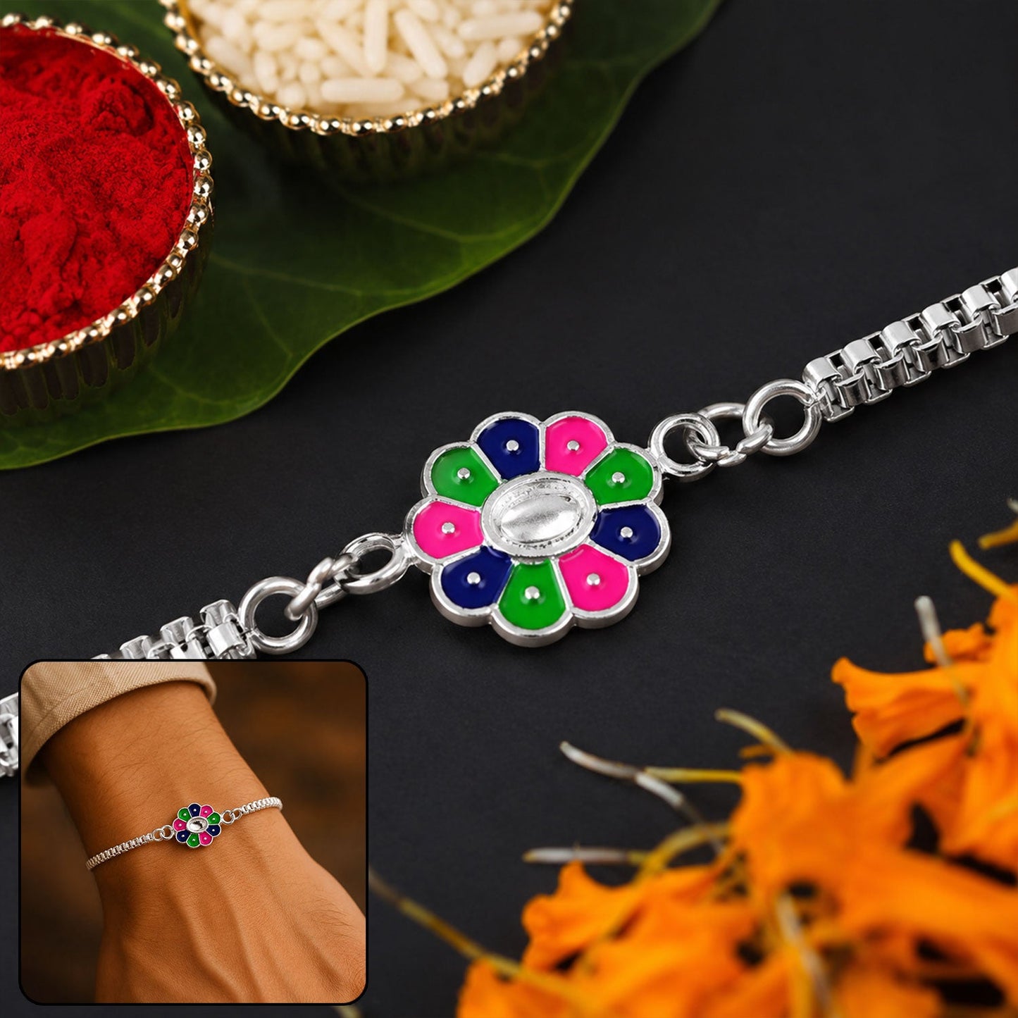 Vibrant flower design Rakhi with intricate enamel work on a silver-tone chain.