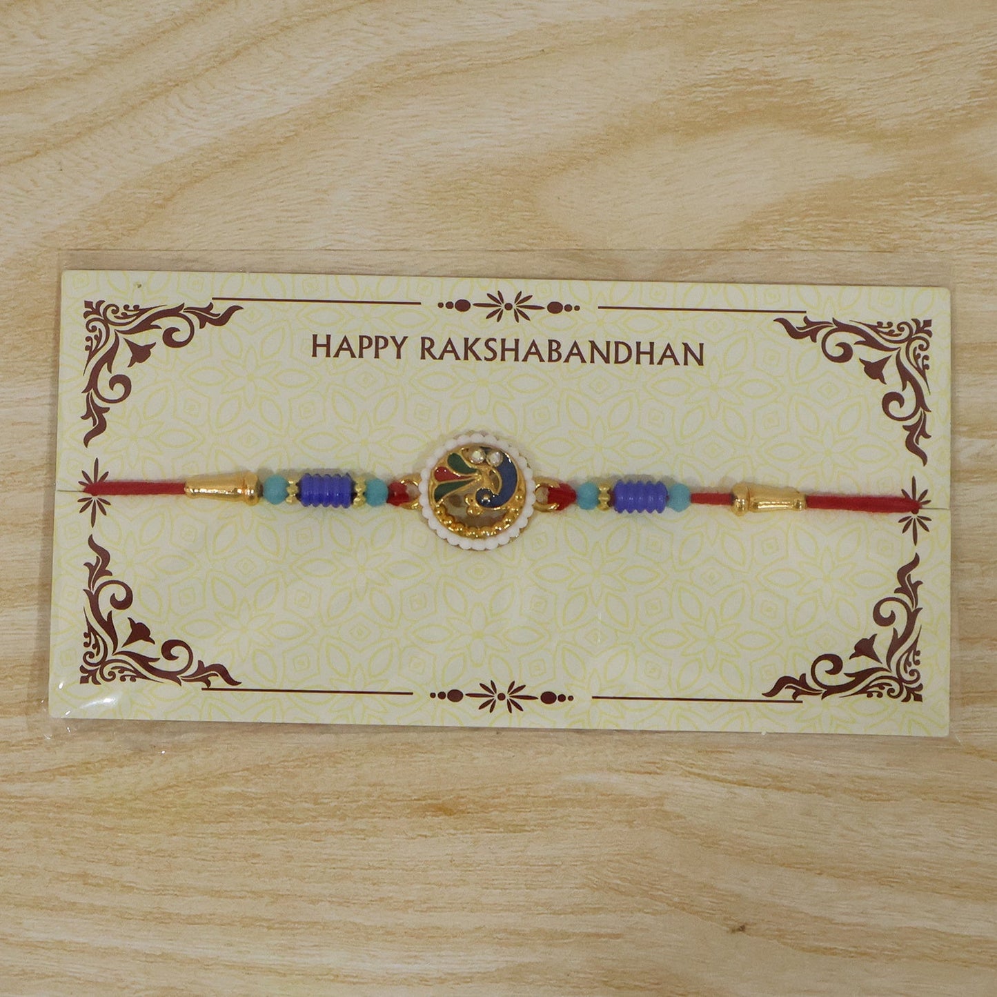 Complete view of designer peacock pearl rakhi