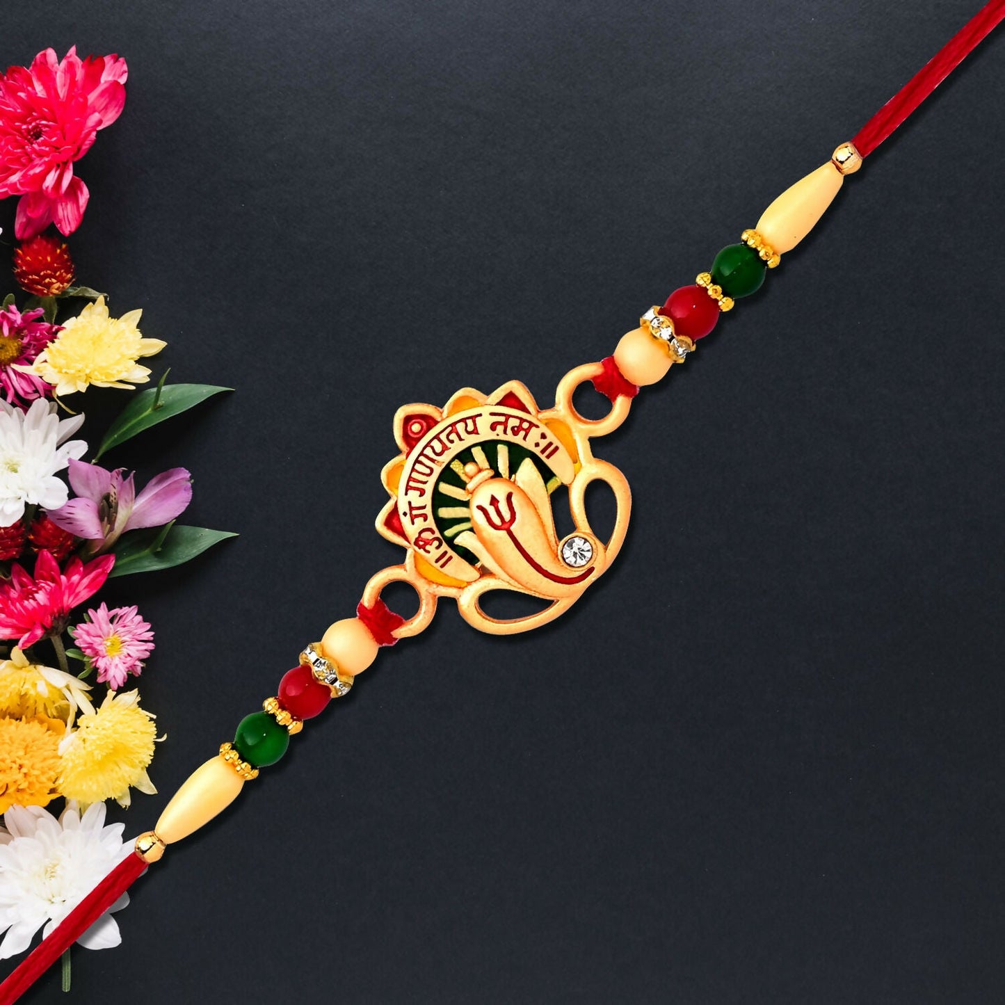 Om Ganesha Rakhi displayed on festive background ready for Raksha Bandhan.