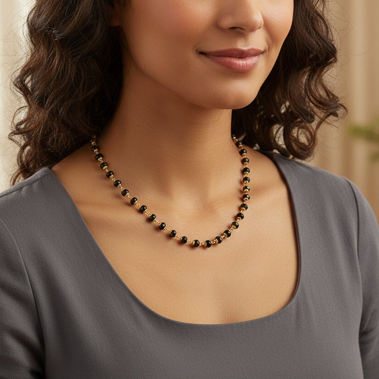 Long gold bead necklace