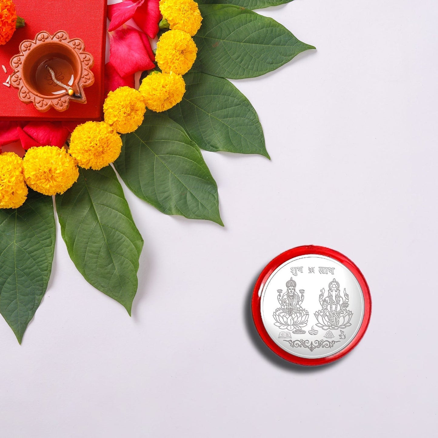 Silver pooja coin included in Ganesh bracelet rakhi combo