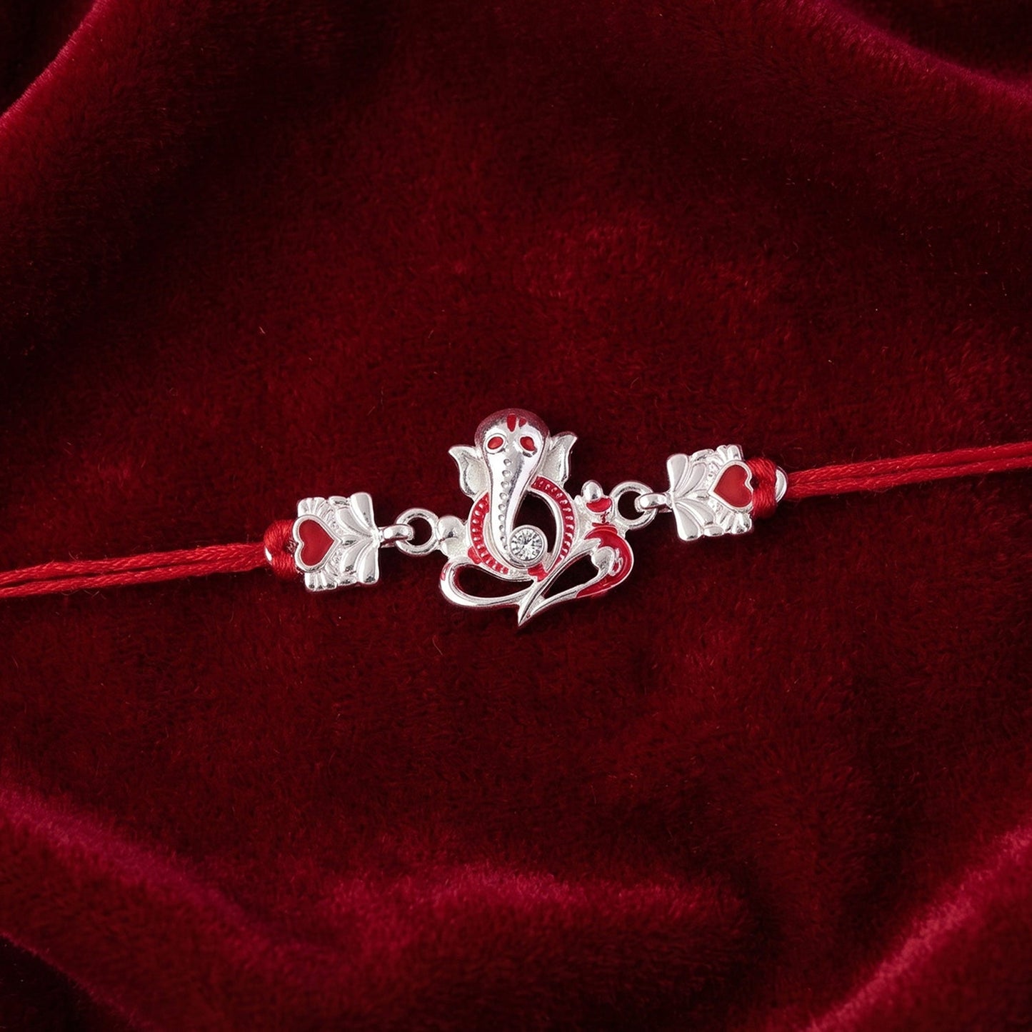 Back view of the silver Ganesha rakhi showing neat thread finish.