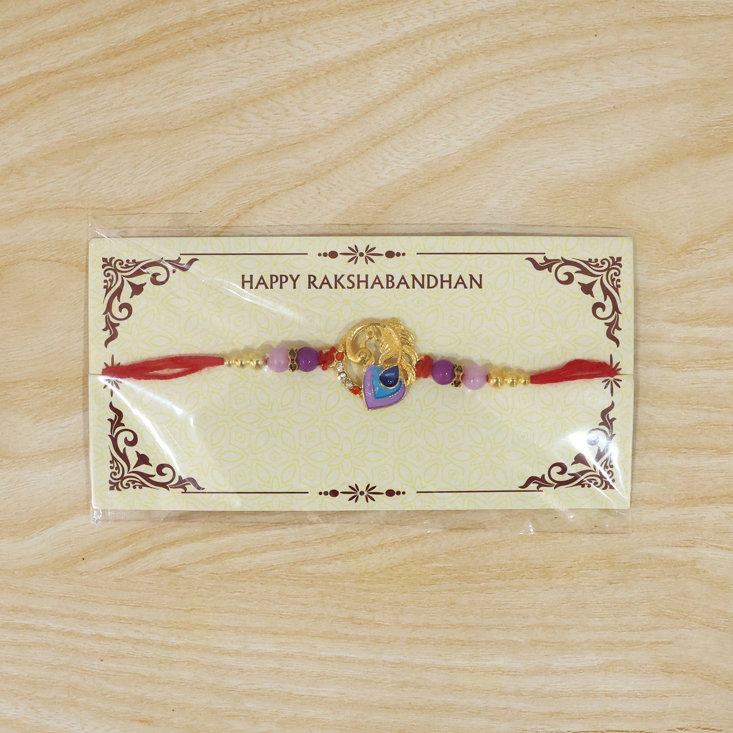 Traditional Peacock Rakhi with soft thread and vibrant colors