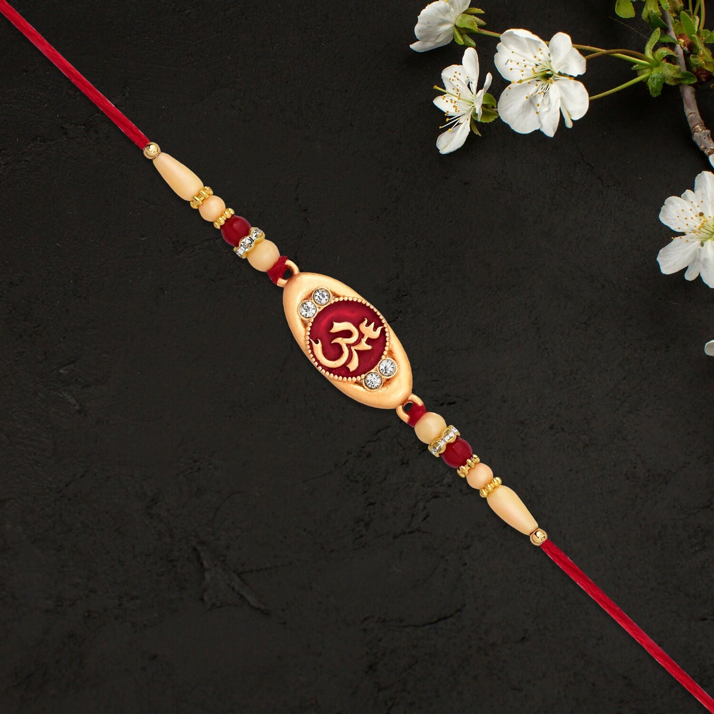 Spiritual Om Rakhi displayed on traditional background for festival gifting