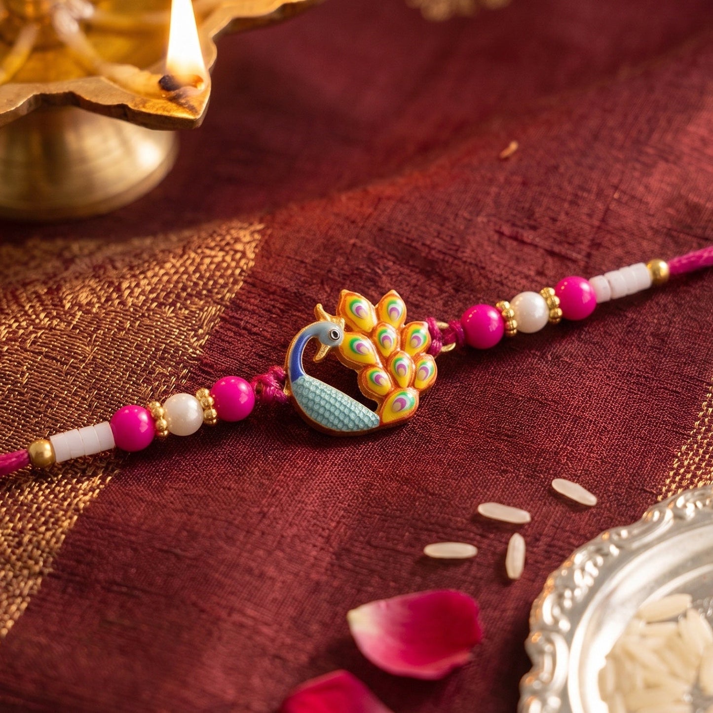 Close-up of intricate Peacock Meenakari centerpiece on Rakhi