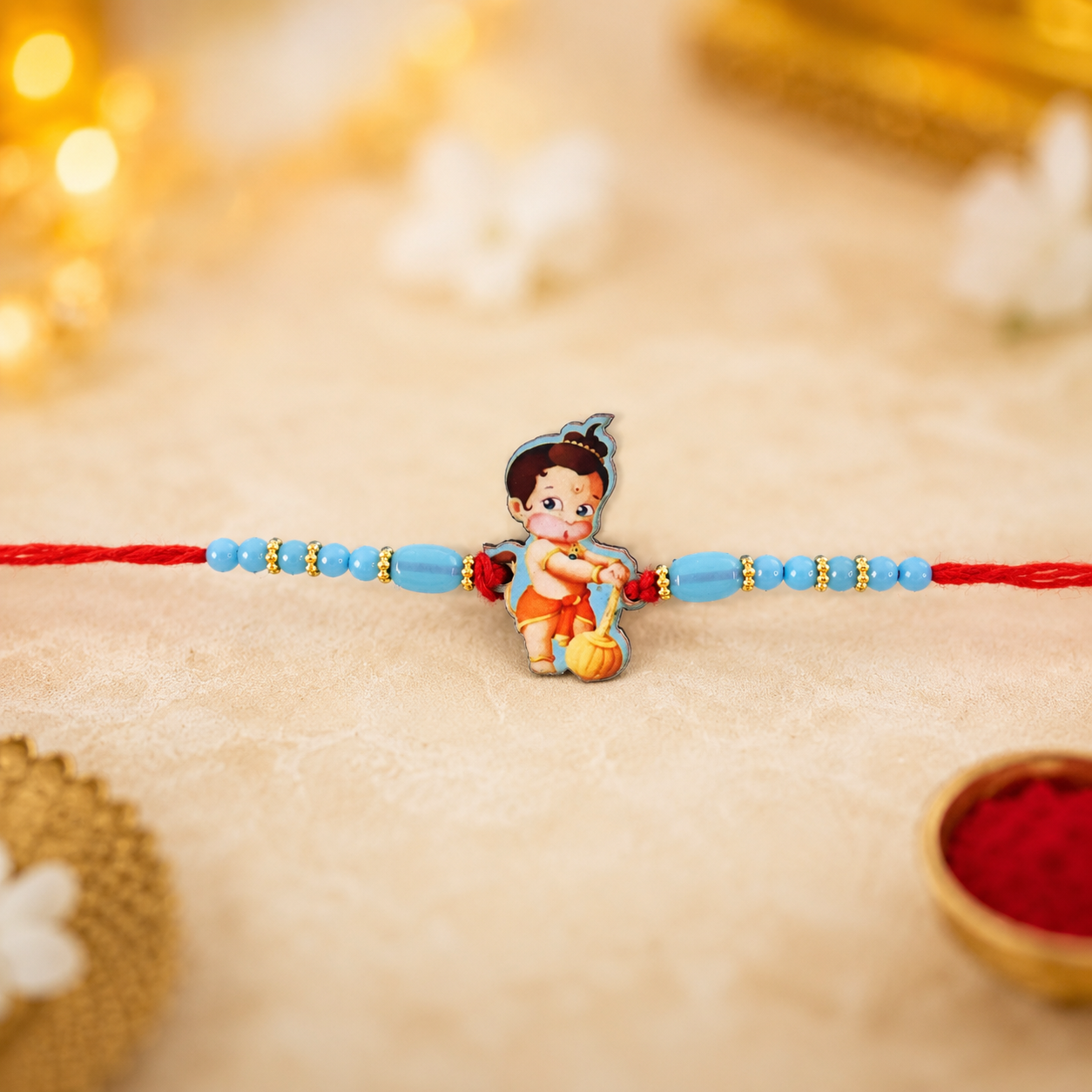 Traditional Rakhi on festive background with Hanuman design.
