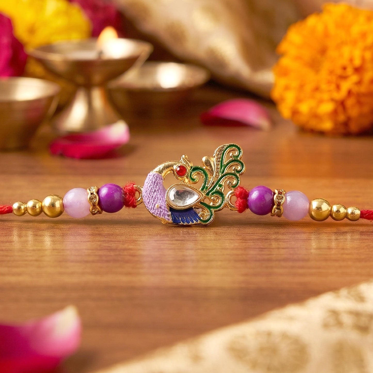 Close-up of intricate peacock design on kundan Rakhi