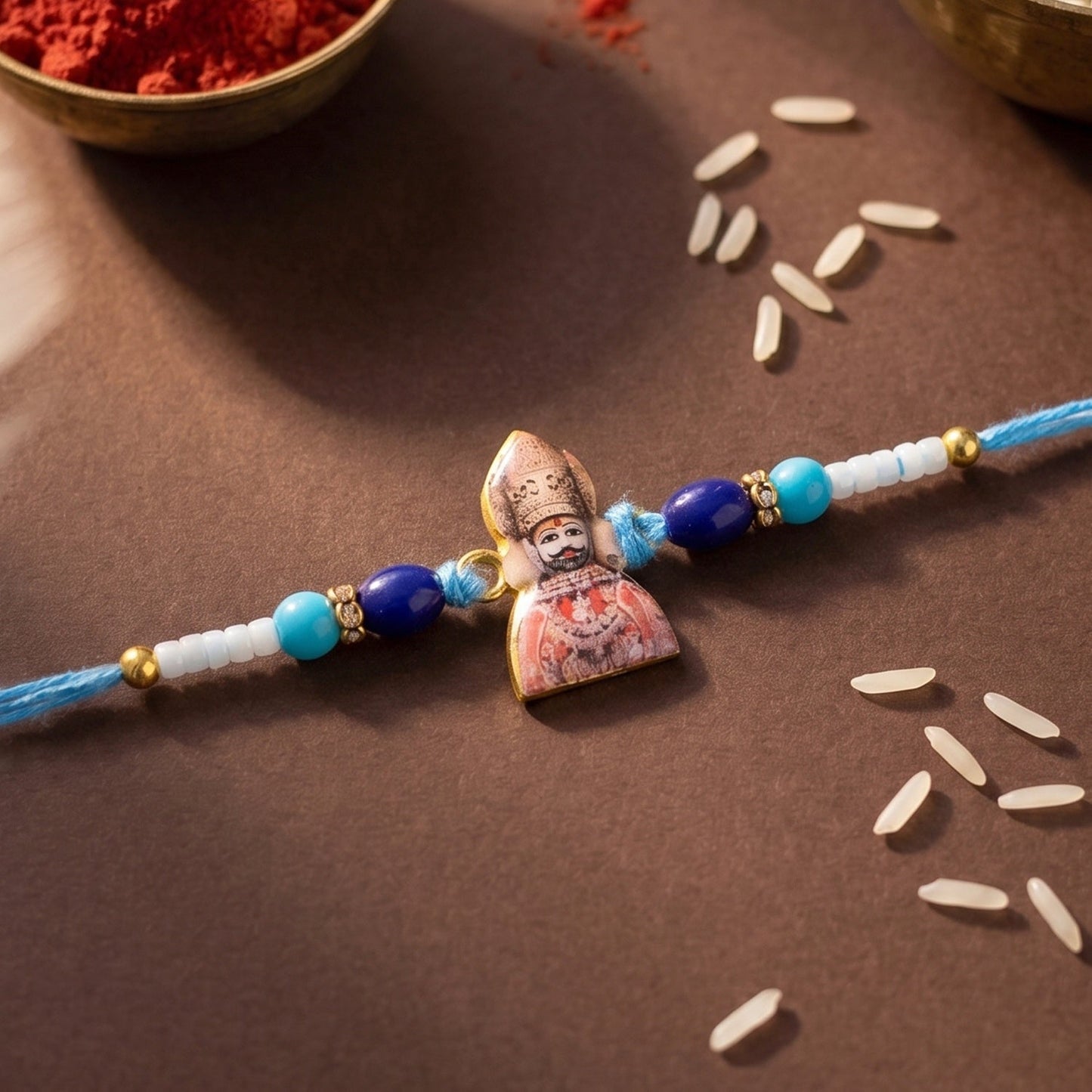 Close-up of Khatu Shyam Ji Rakhi centerpiece with embroidery and beads