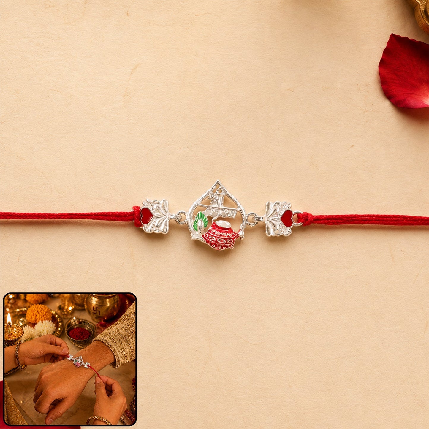 Silver crown Rakhi with pink stone center and red thread on wrist