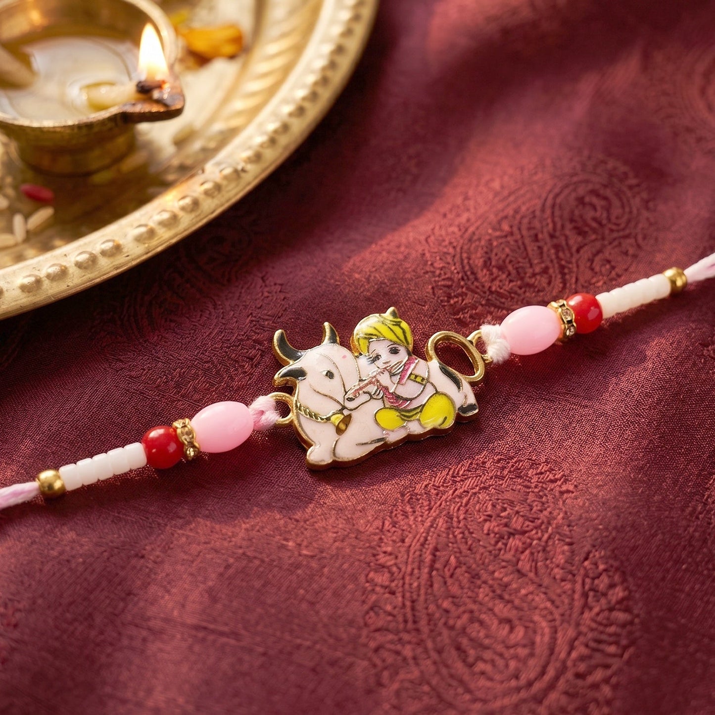 Close-up of soft thread and decorative beads of Krishna Rakhi