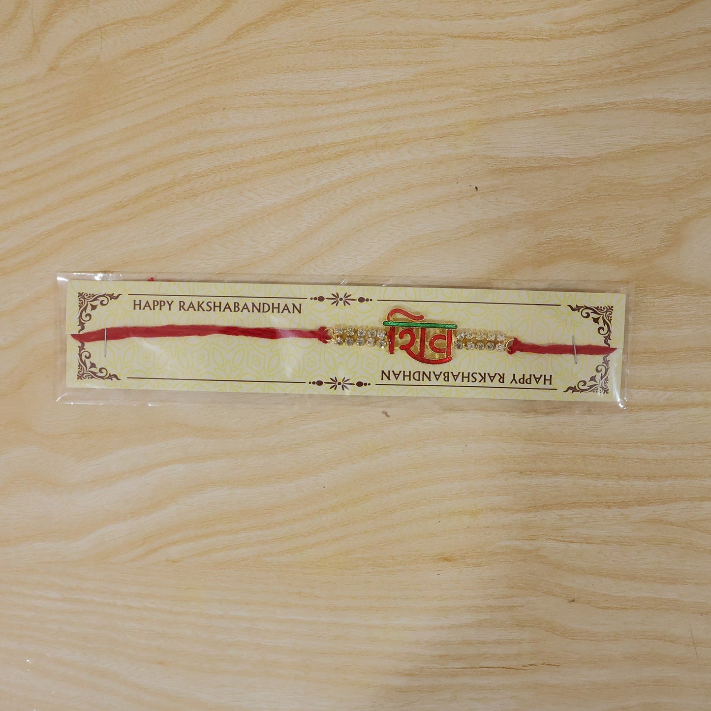 Complete Shiv letter rakhi showing beads and overall design