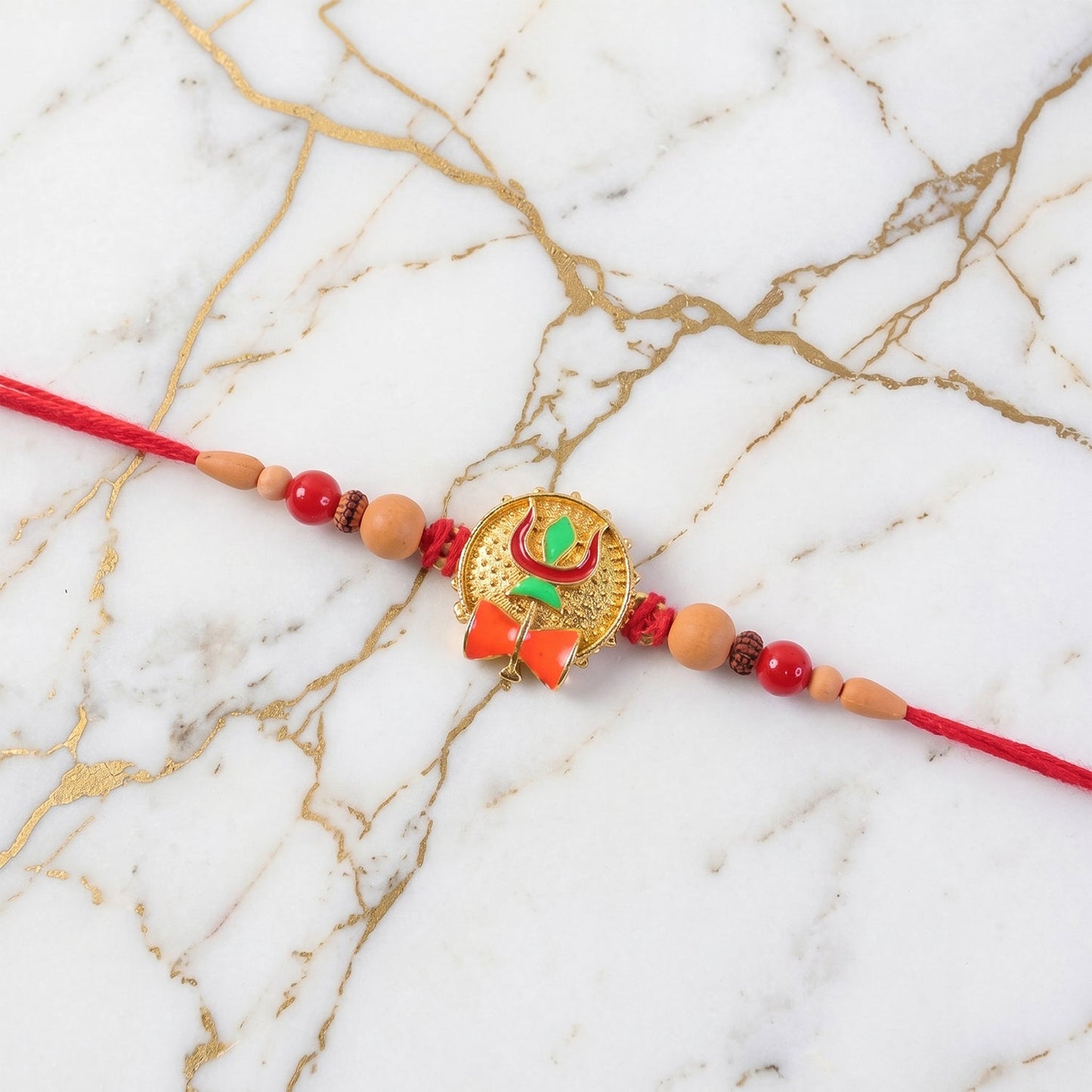 Rakhi laid out on white background highlighting design