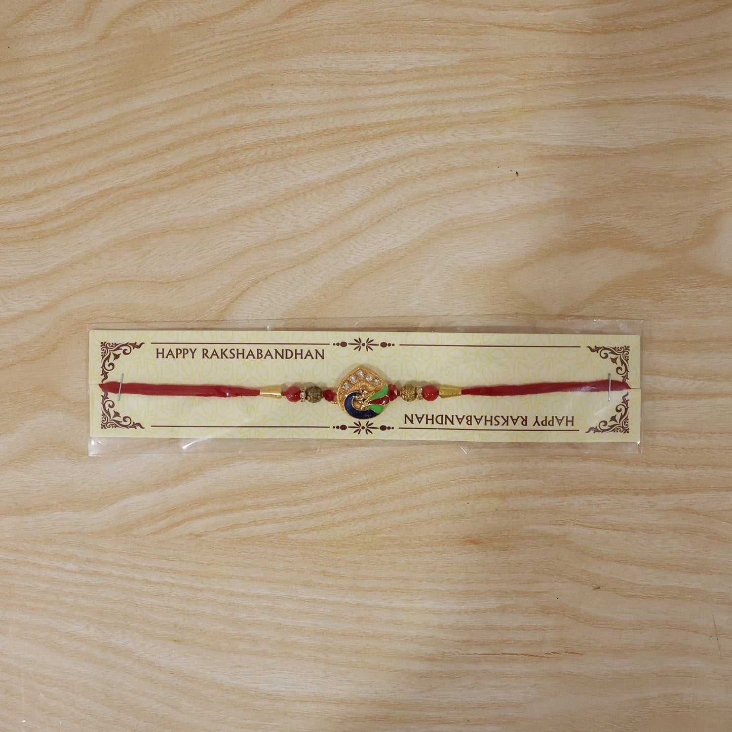 Beautifully designed peacock feather rakhi for Raksha Bandhan celebration