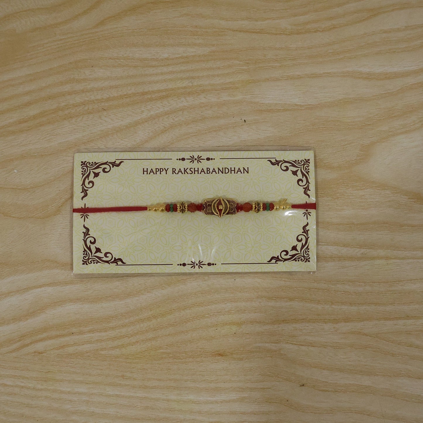 Full view of the antique oxidized Rudraksha Rakhi showing its complete design.