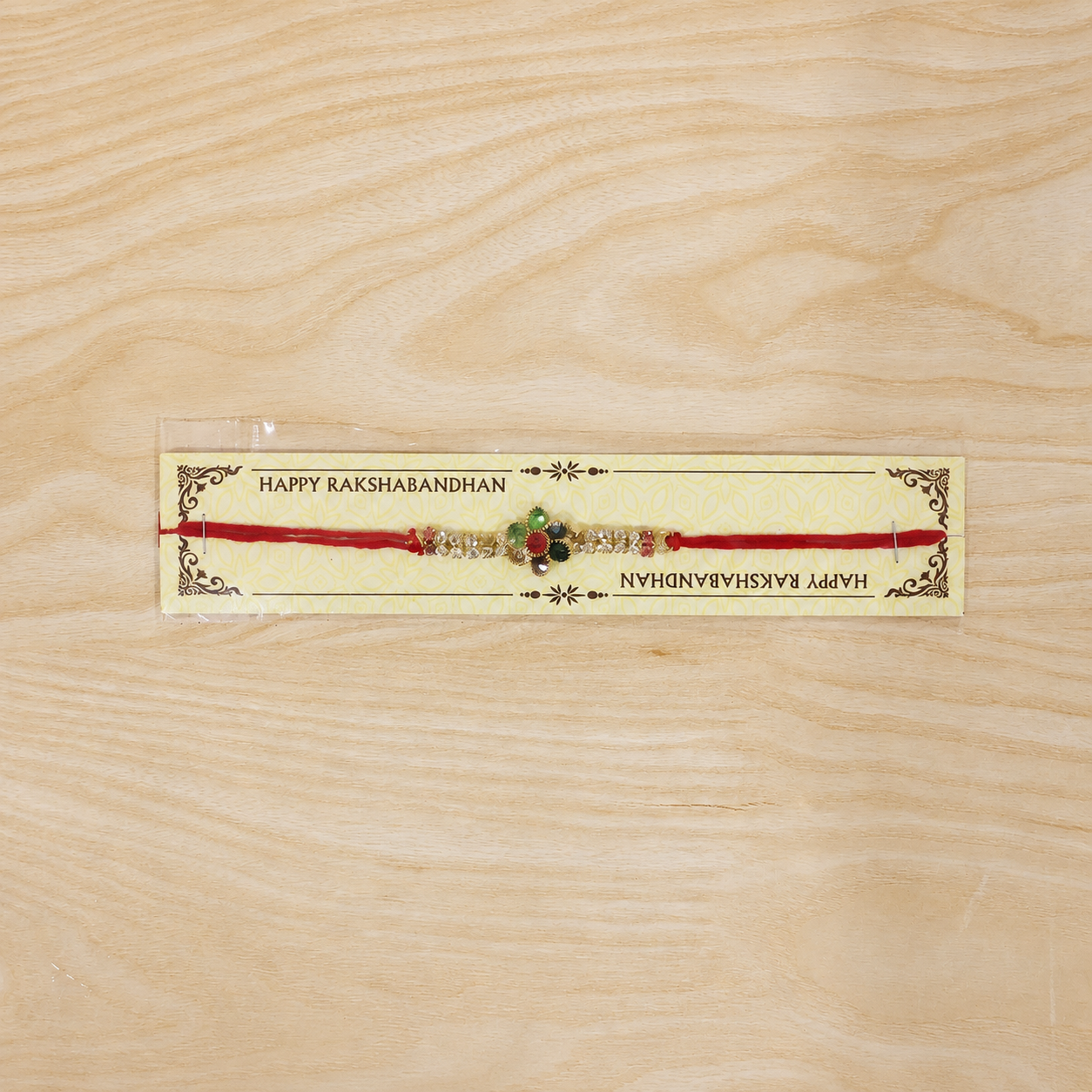 Beautiful decorative rakhi with thread and gold bead embellishments