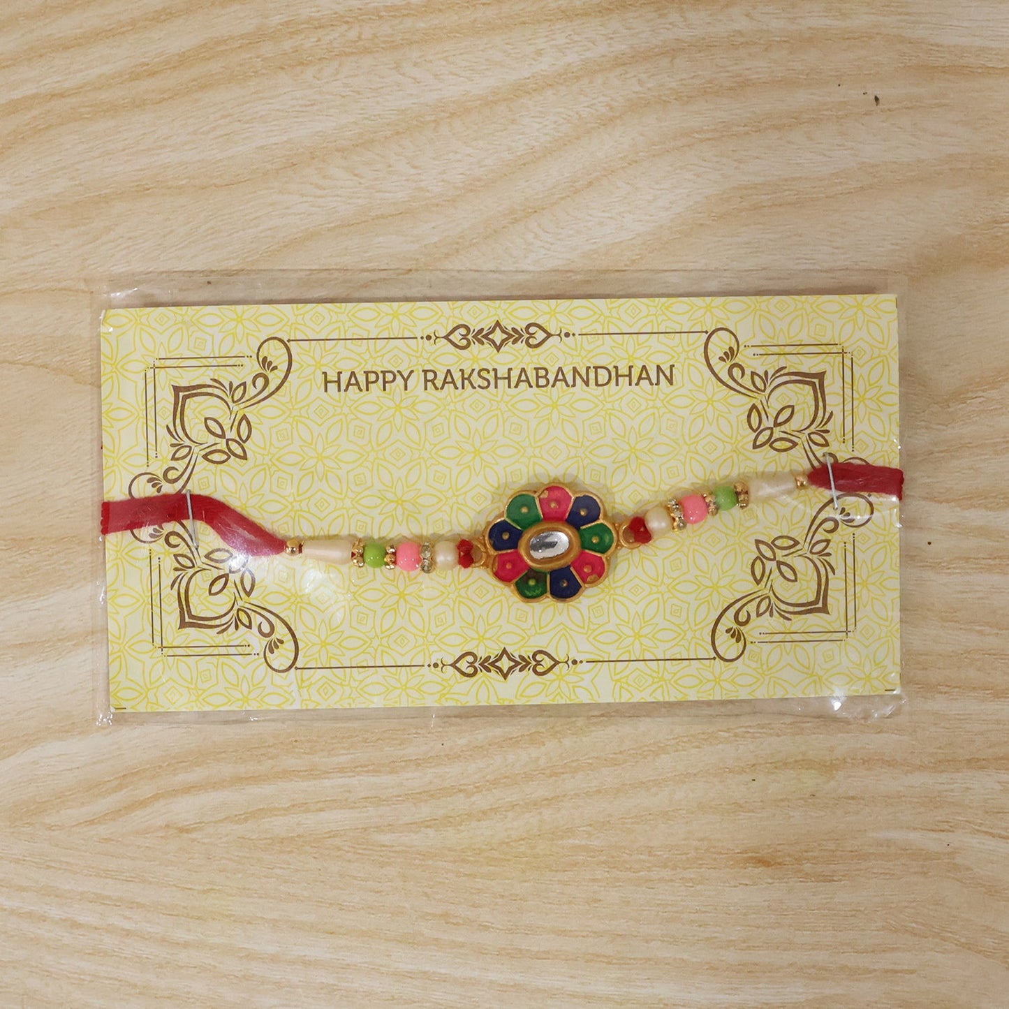 Vibrant multicolor flower rakhi viewed from an angle