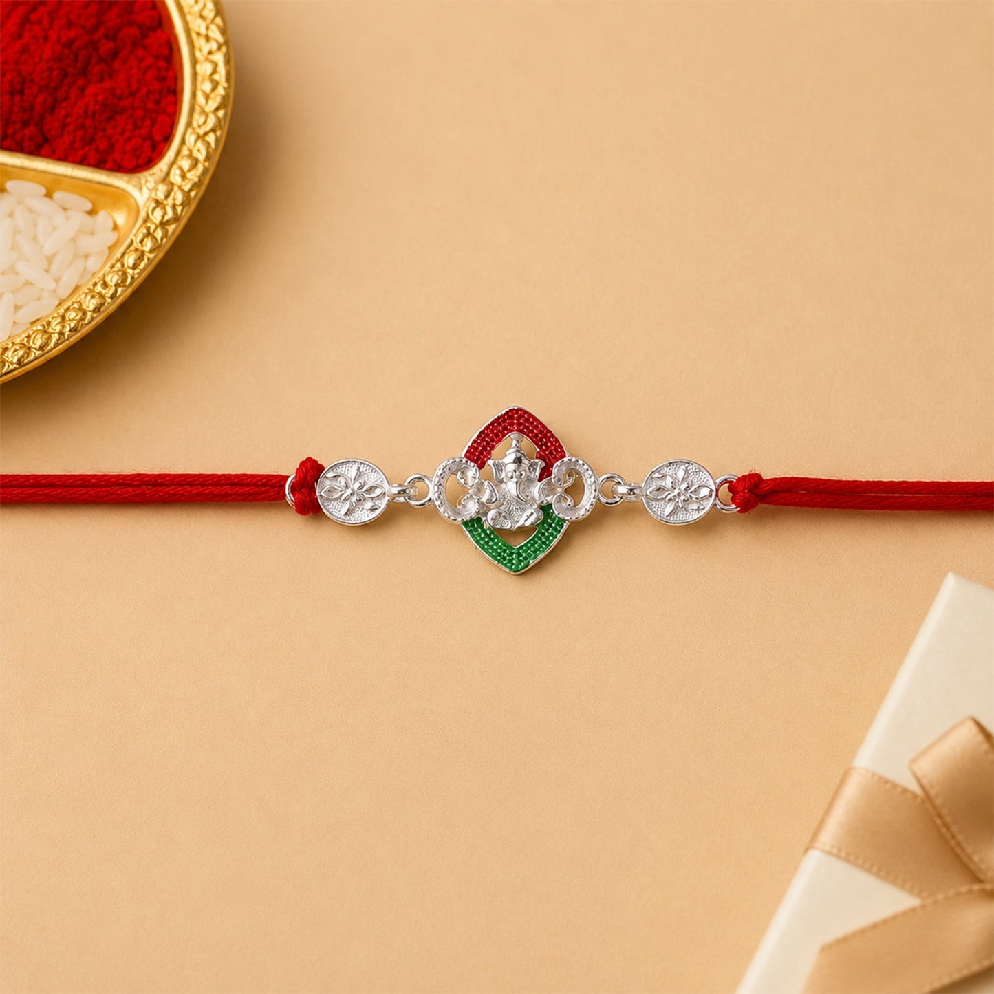 Festive display of Silver Green Floral Rakhi with decorative elements