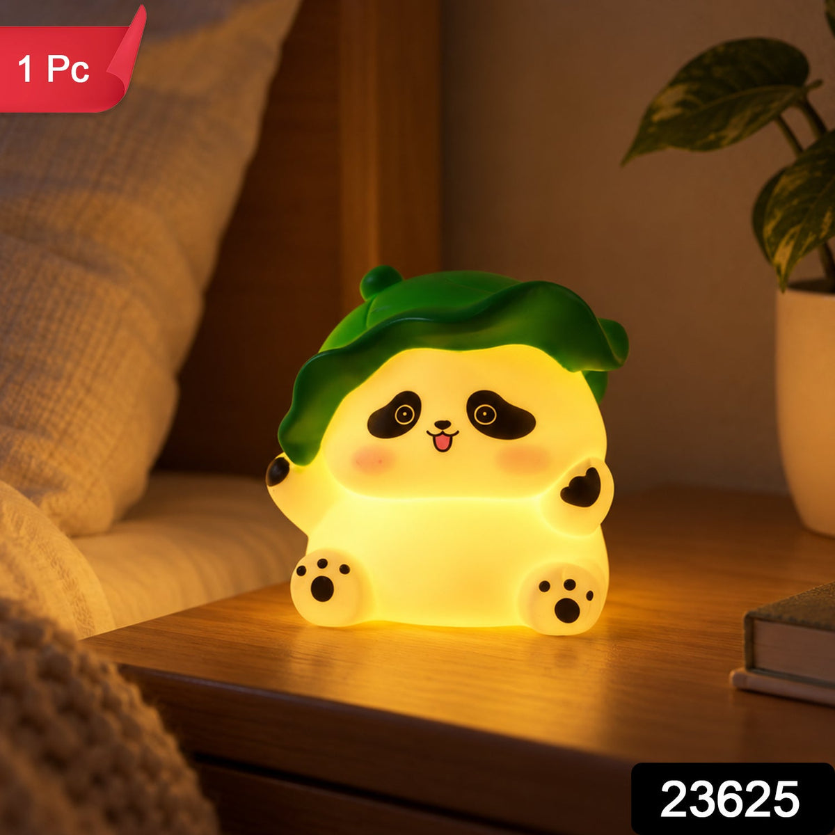 A glowing panda night light with a green leaf hat sits on a bedside table next to a plant, with a red "1 Pc" label.