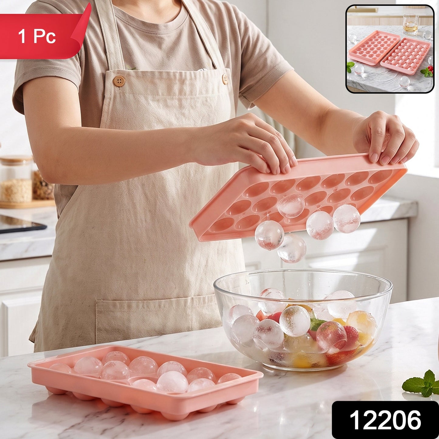 A person in an apron holds a pink ice ball tray, releasing clear ice balls into a glass bowl of fruit, with a '1 Pc' label.