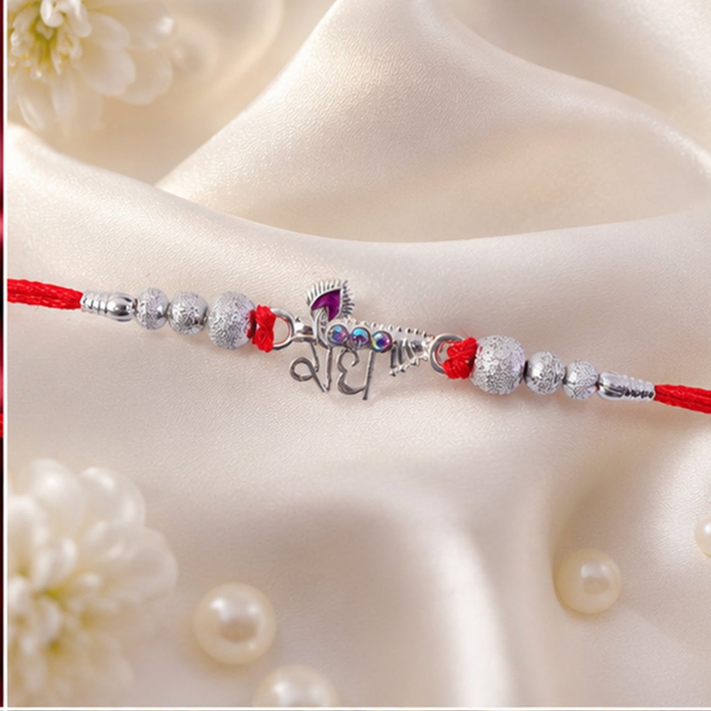 Close-up of intricate silver-tone decorative beads on the Radhe Silver Rakhi.