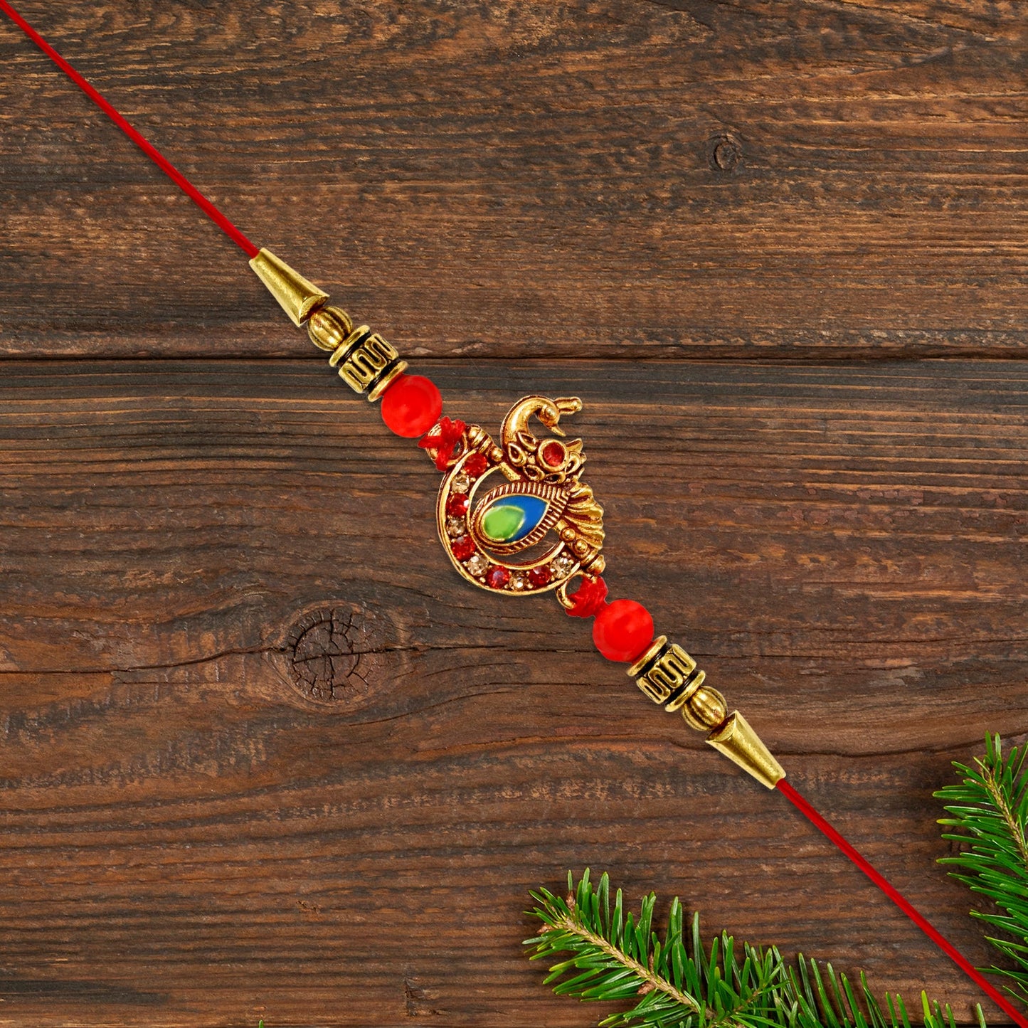 Beautiful Stone Studded Rakhi showcasing intricate design with sparkling stones on white background.