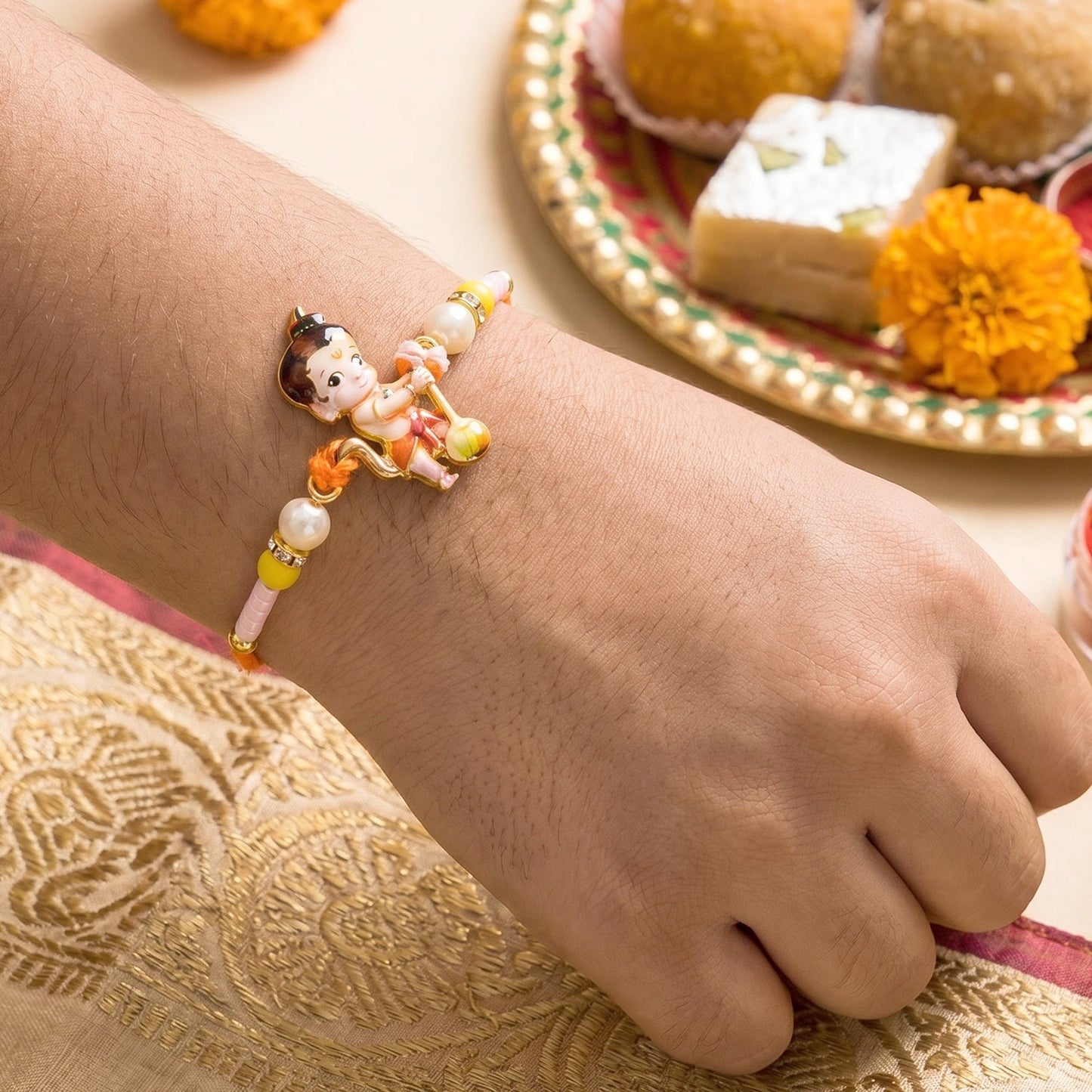 Brother’s wrist adorned with the divine Bal Hanuman Rakhi.