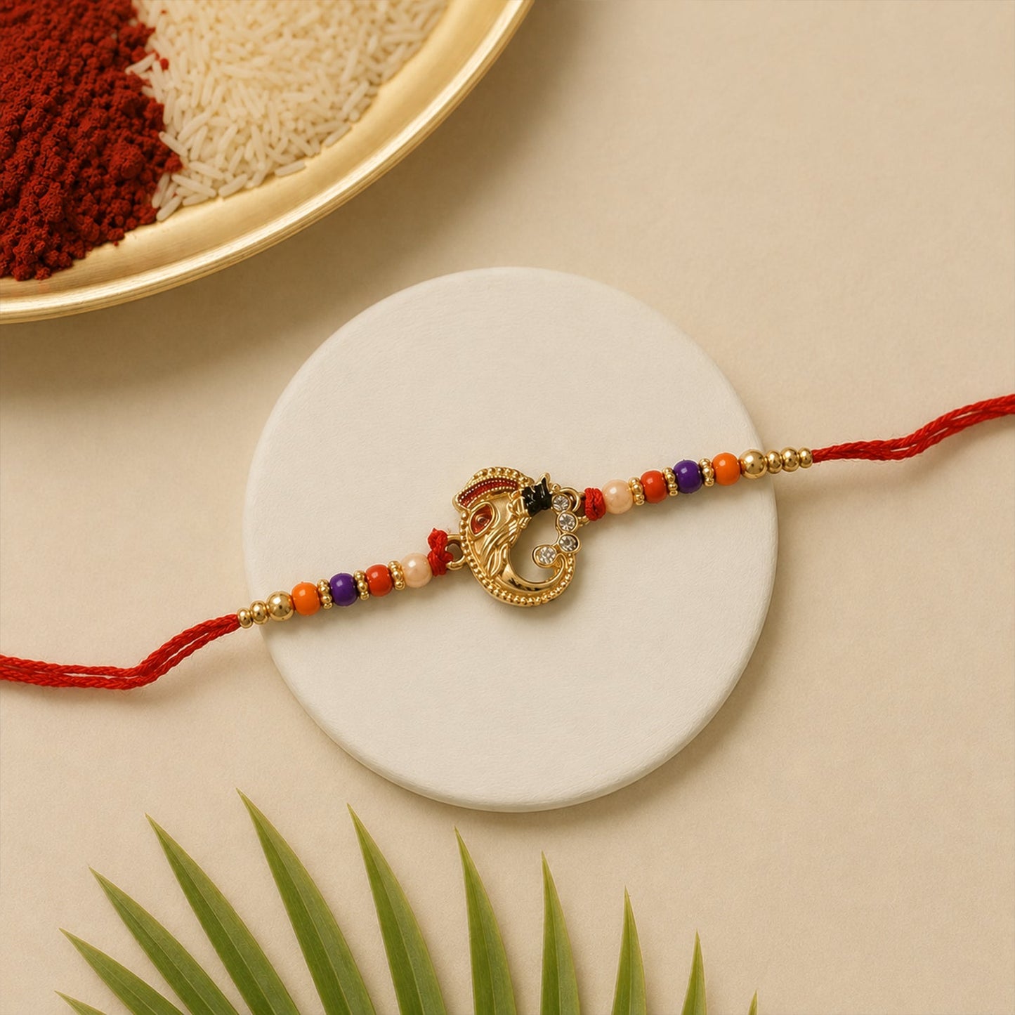 Elegant traditional rakhi with detailed threadwork and decorative centerpiece