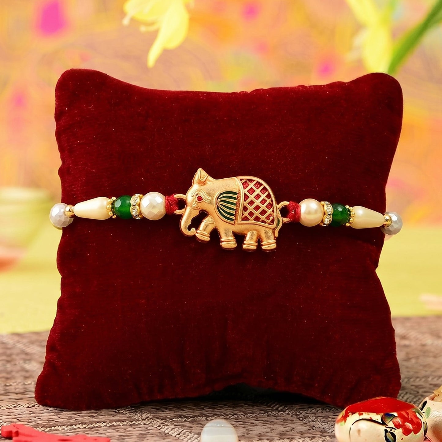 Detailed view of handcrafted Elephant Rakhi, highlighting premium materials and artistry.